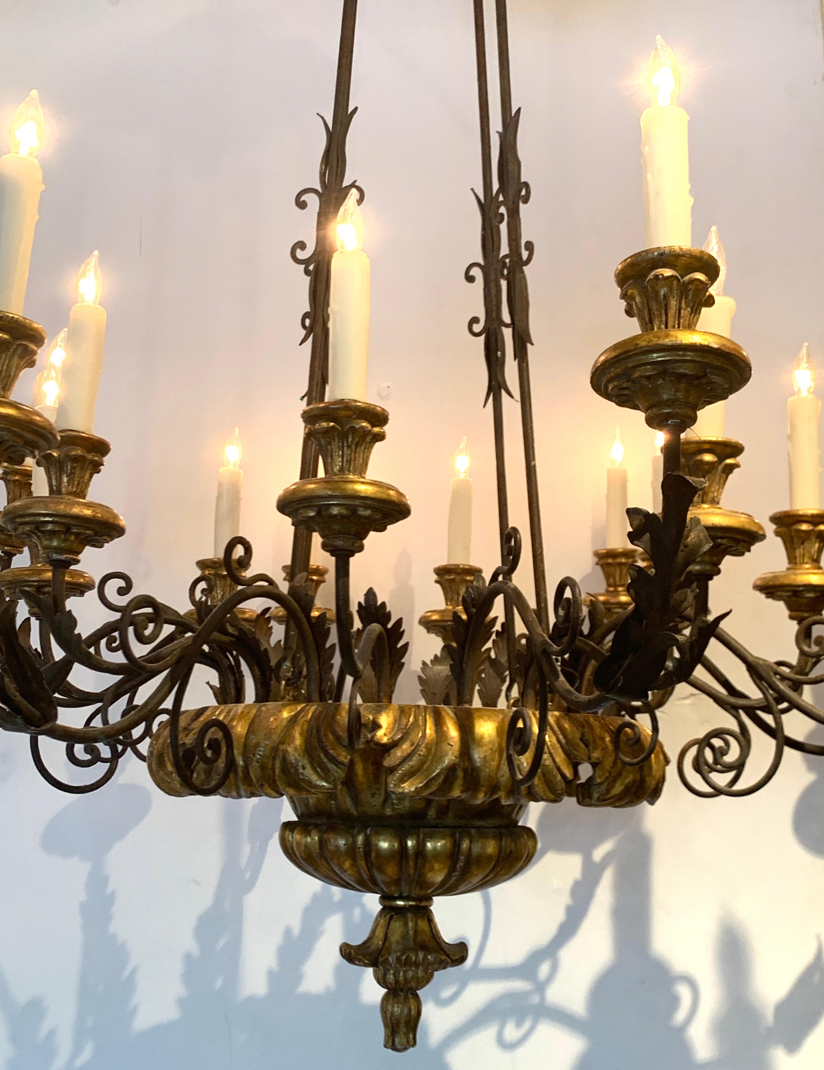 Neoclassical Italian Neoclassic Carved Giltwood and Iron 18-Light Chandelier