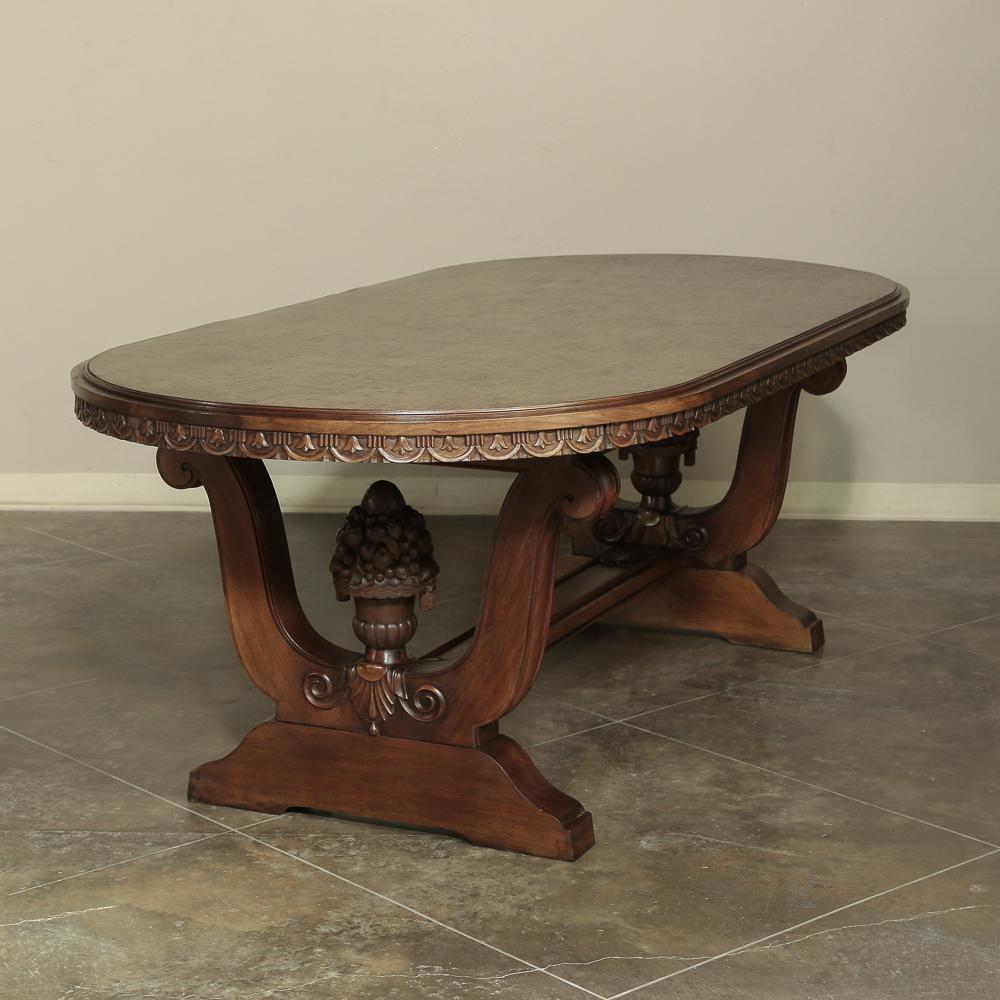 Amazing Italian neoclassic oval walnut dining table, recalling the glory days of ancient Greek and Roman civilizations, this stunning dining table has captured the Classic architecture from that storied period of history in sumptuous walnut with