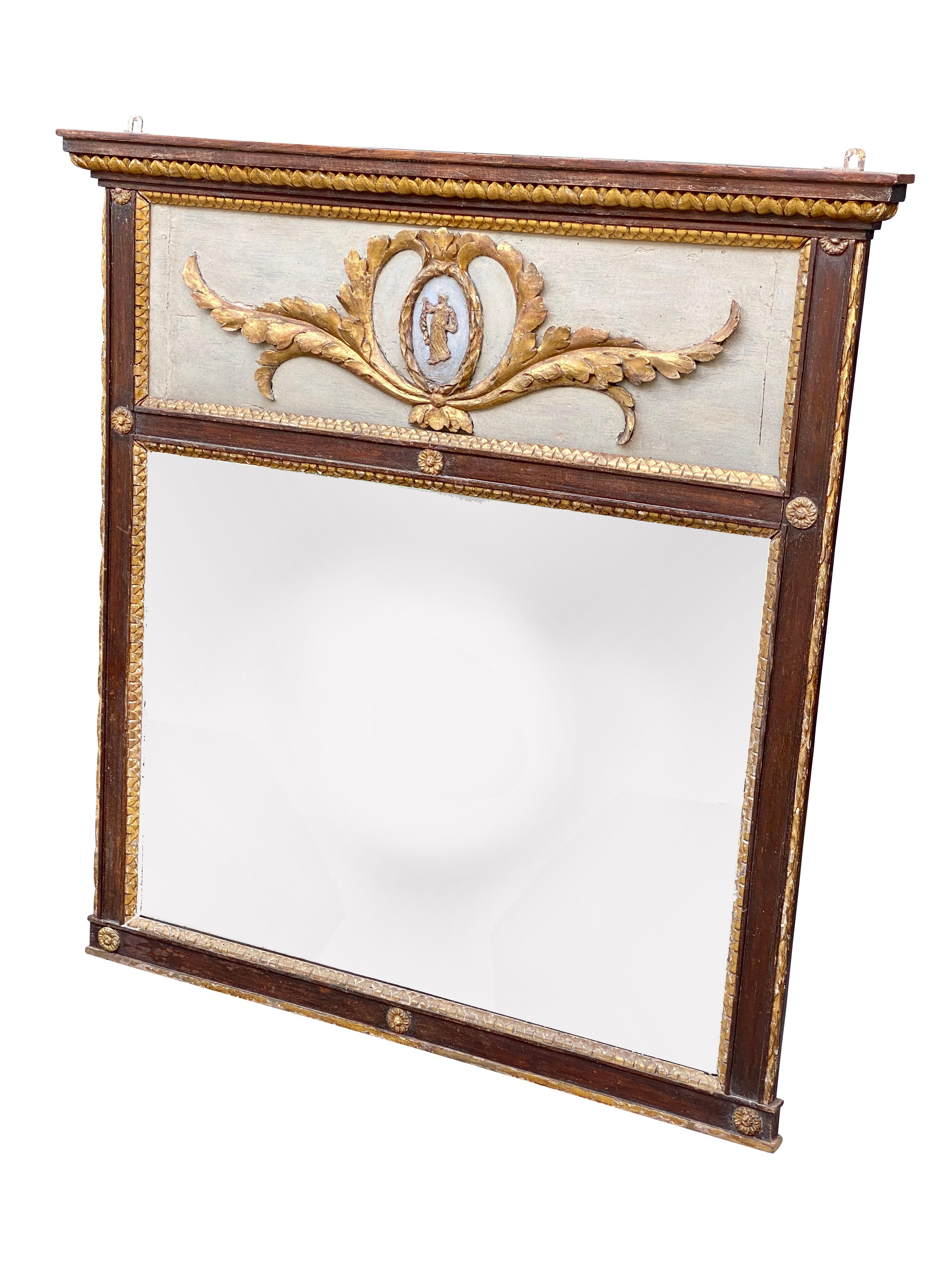 Rectangular with leaf tip carved cornice over a panel with central portrait medallion surrounded by trailing leaves over a mirror plate. Painted frame with rosettes and gilt details.