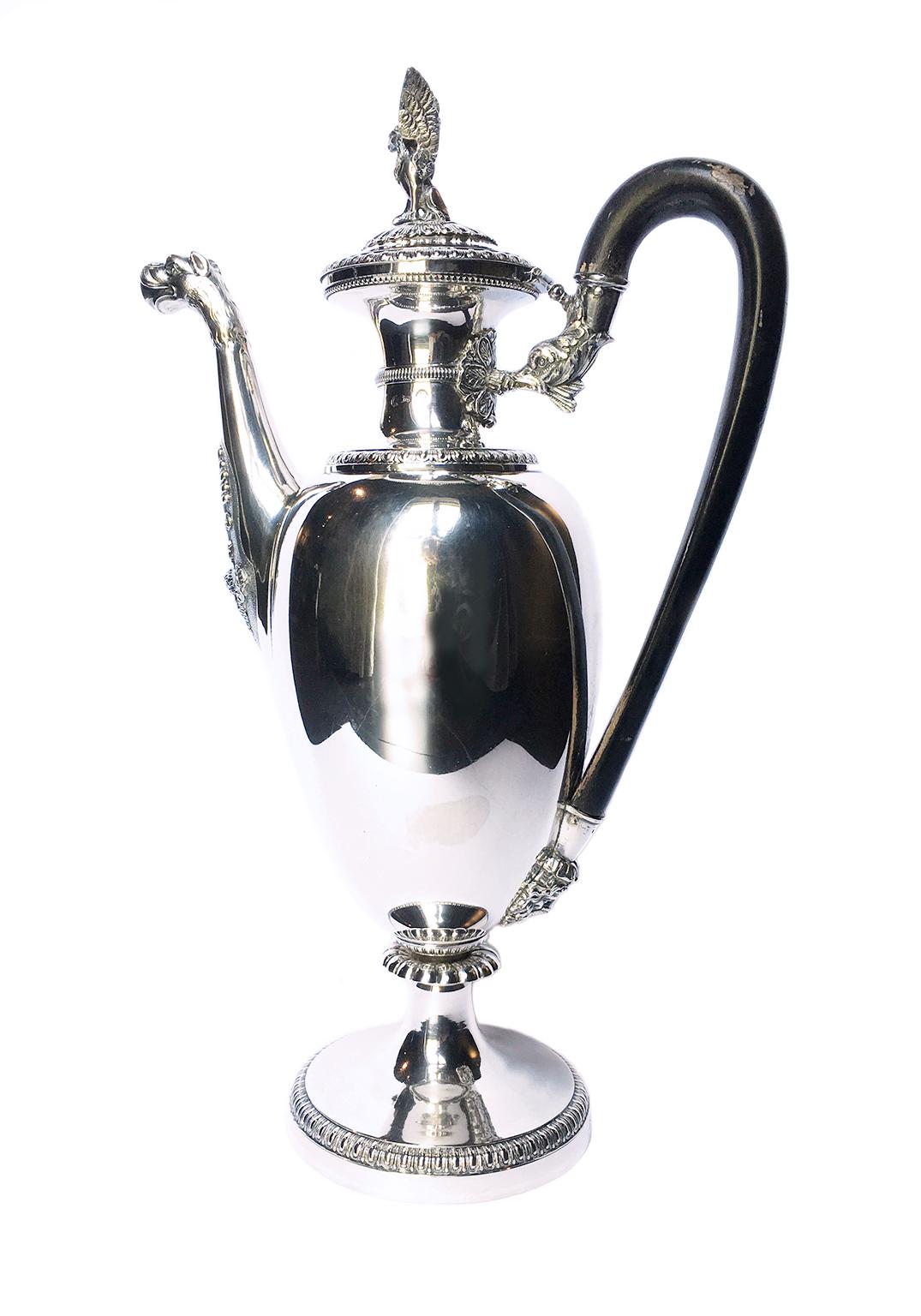 Embossed and engraved sterling silver coffee pot
Tommaso Panizza (1805-1868)
Milan, circa half of the 19th century
It measures 13.97 in (cm 35.5) in height x 8.66 in (22 cm) x 4.72 in (12 cm)
It weighs 1.94 lbs (884 g)
State of conservation: