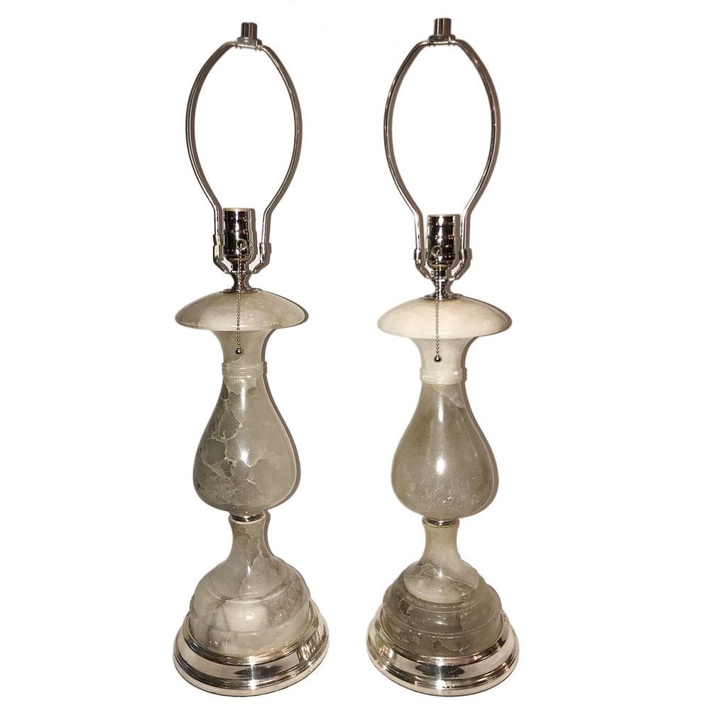Pair of circa 1940's Italian carved alabaster table lamps with nickel plated bases.

Measurements:
Height of body: 18.5