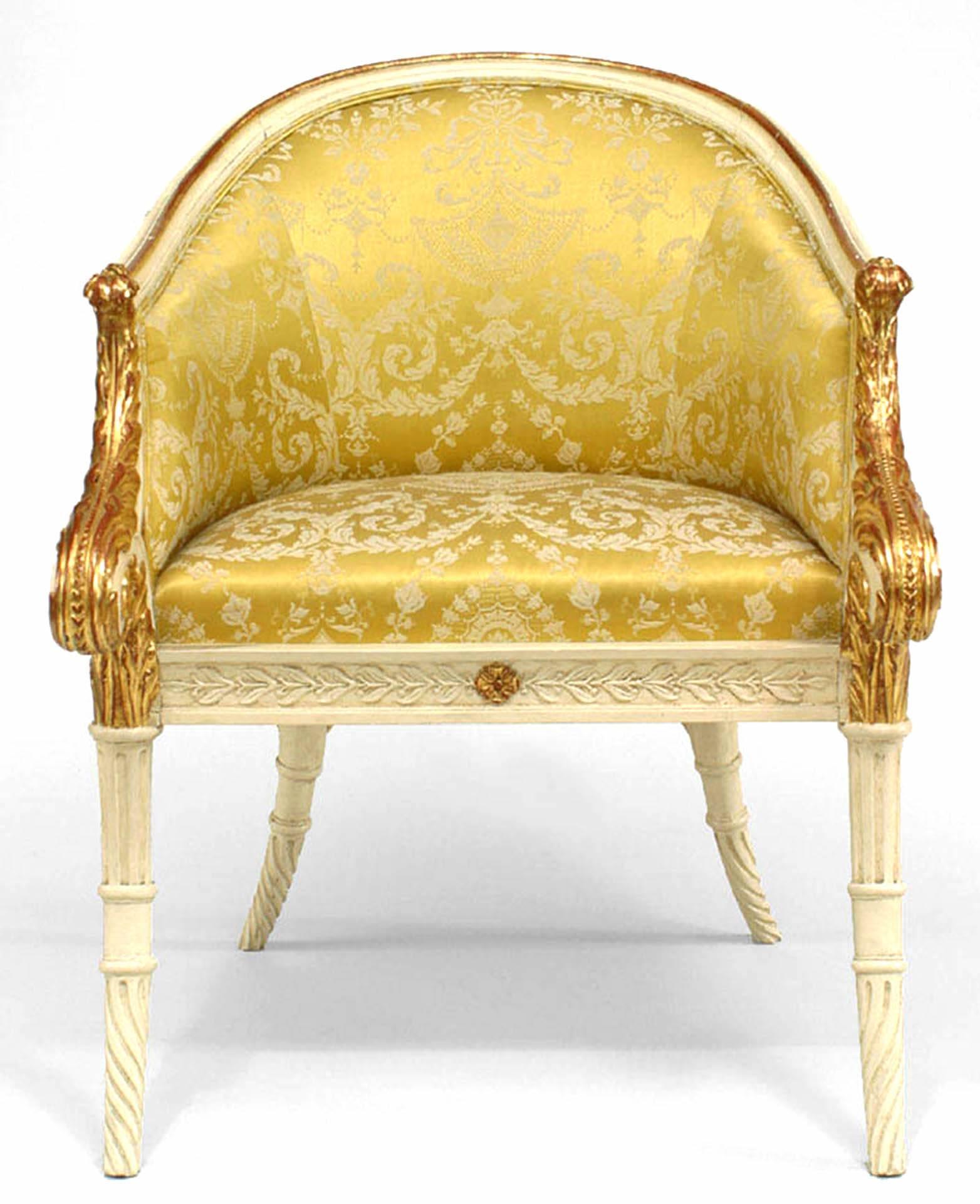 Italian neoclassic style white and gold painted round back carved armchair with front scroll design and gold damask upholstery (19th century).
 