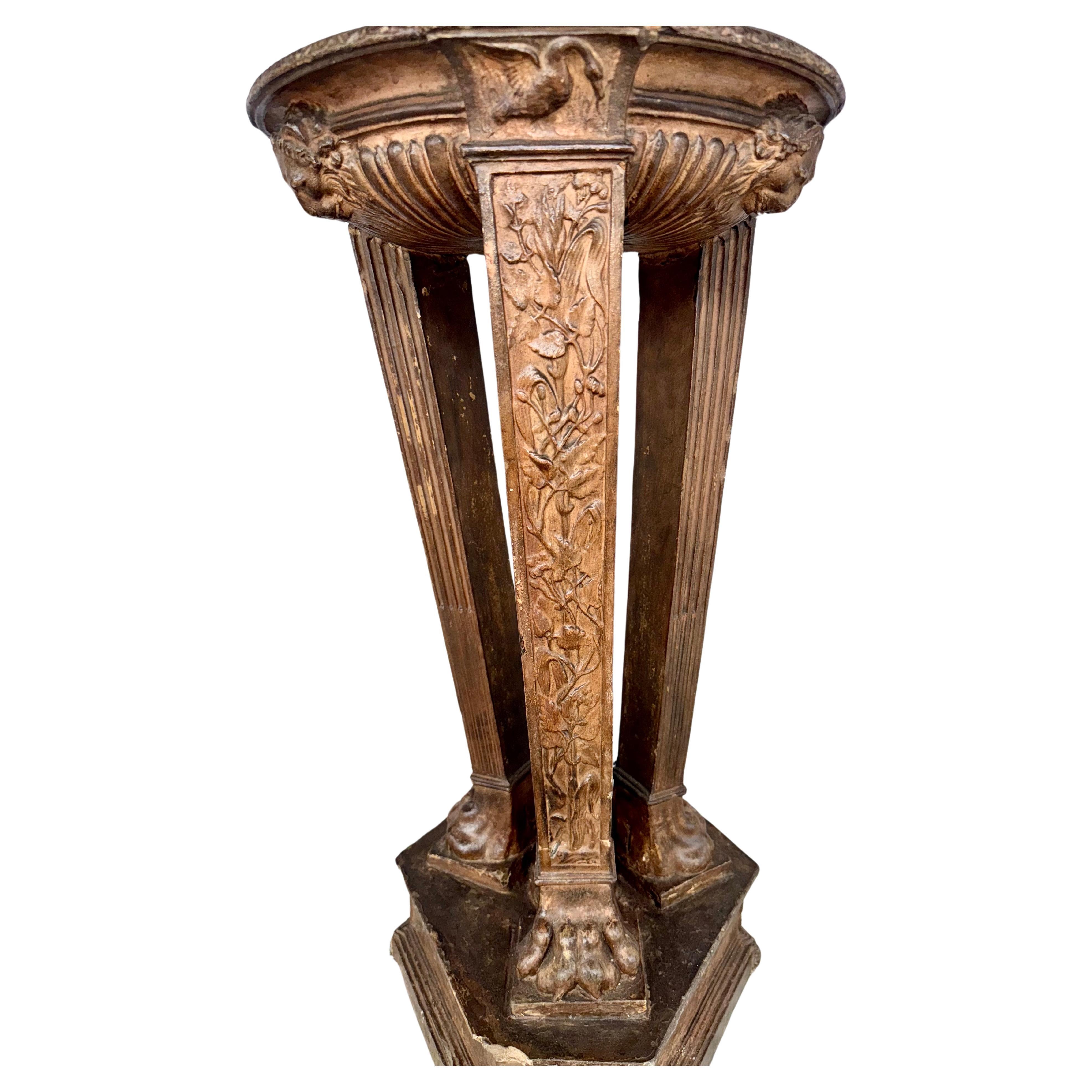 Early 19th century Italian terra cotta Athenienne stand, probably made by the Piranesi Factory. The design draws its inspiration from the classical incense burner which had a tripod stand and was intended for ornamentation or as a perfume burner. It