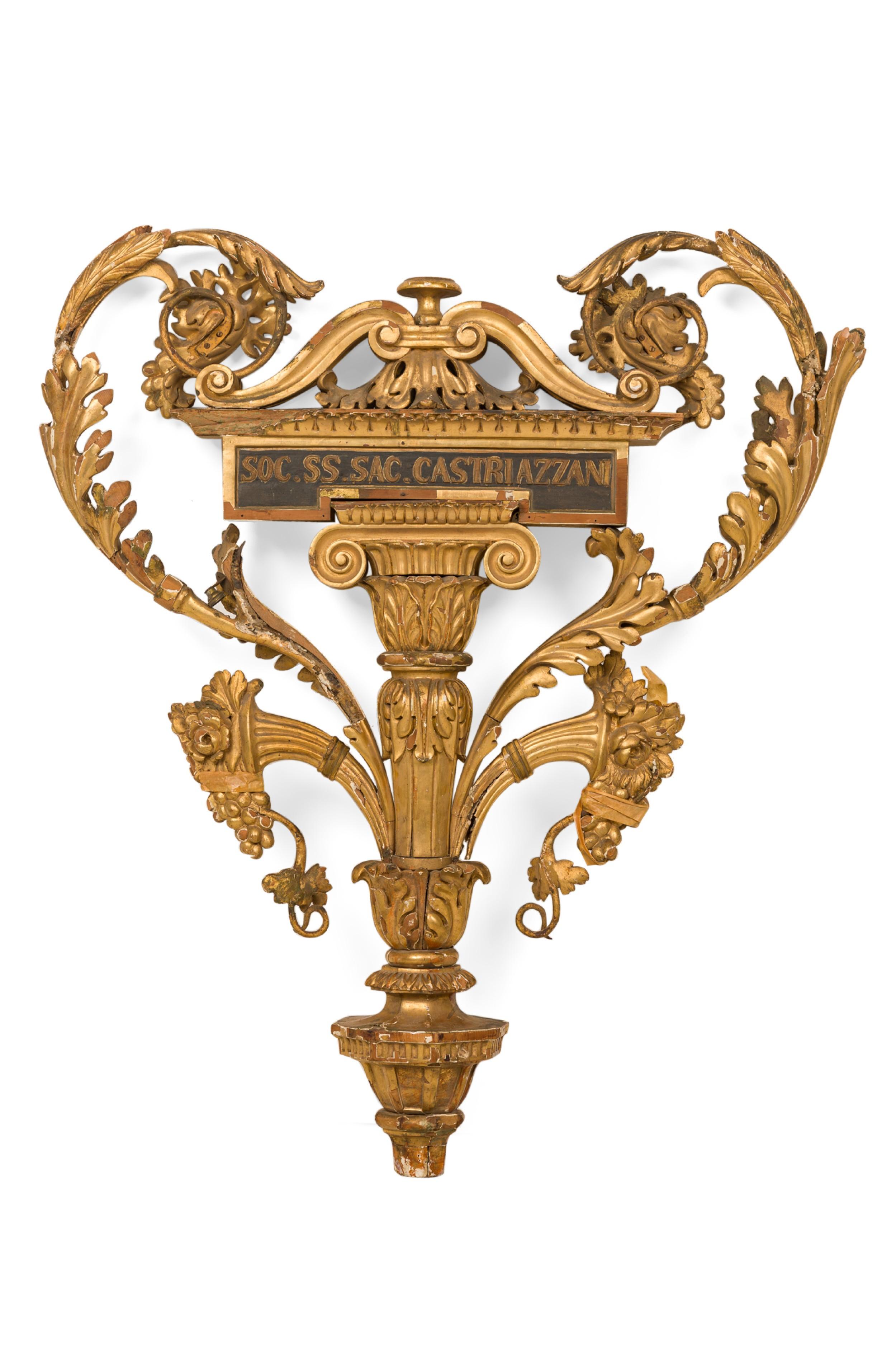 Italian Neoclassic (18th Century) gilt carved wood and metal wall plaque with a centered column and capital with an eminating scroll and cornicopia design
 

 Condition: Fair Condition with minor structural damages and losses to gilding