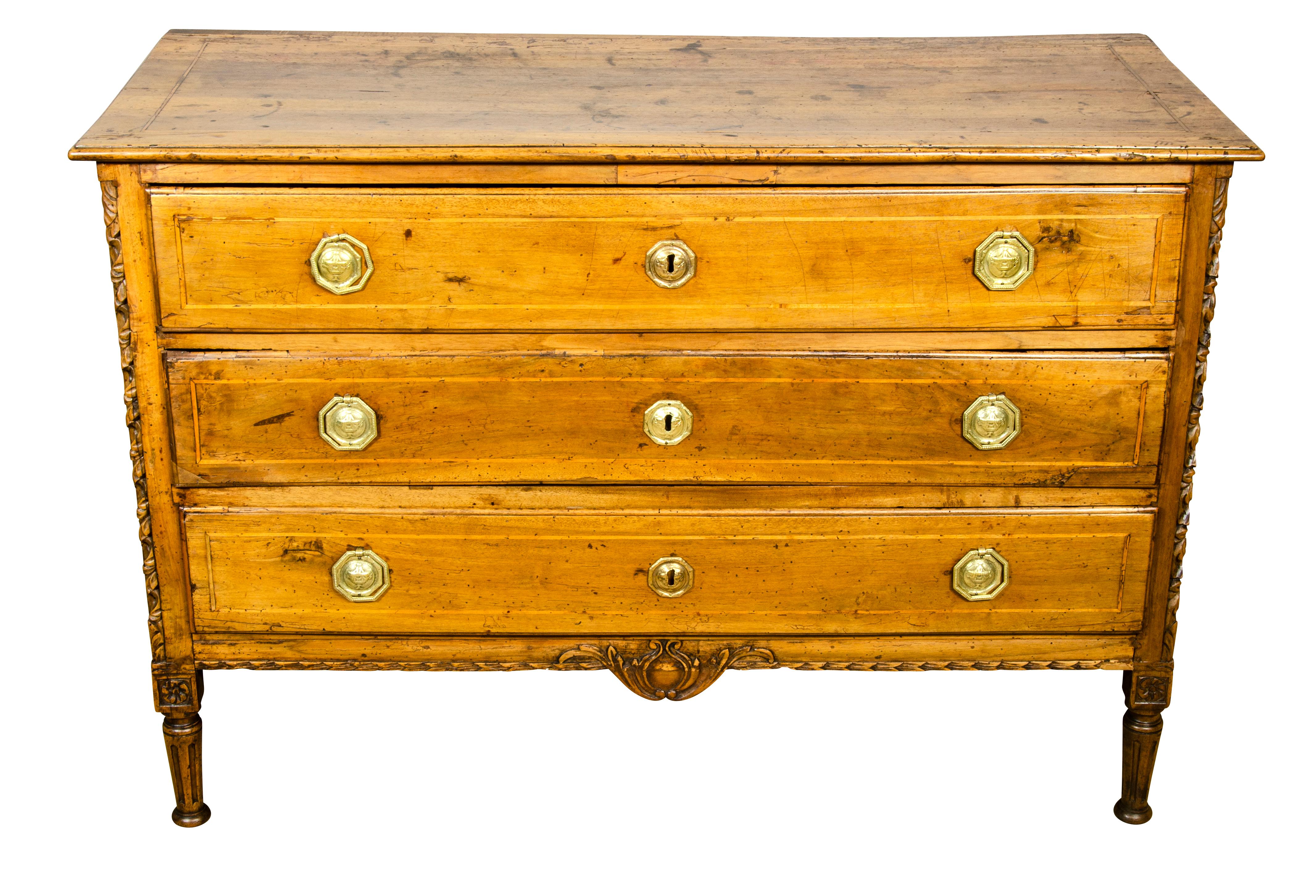 Rectangular top with string banded inlay over three drawers, flanked by a framed case with carved corners and central carving on apron, raised on circular tapered fluted legs headed by carved rosettes. Brass handles.