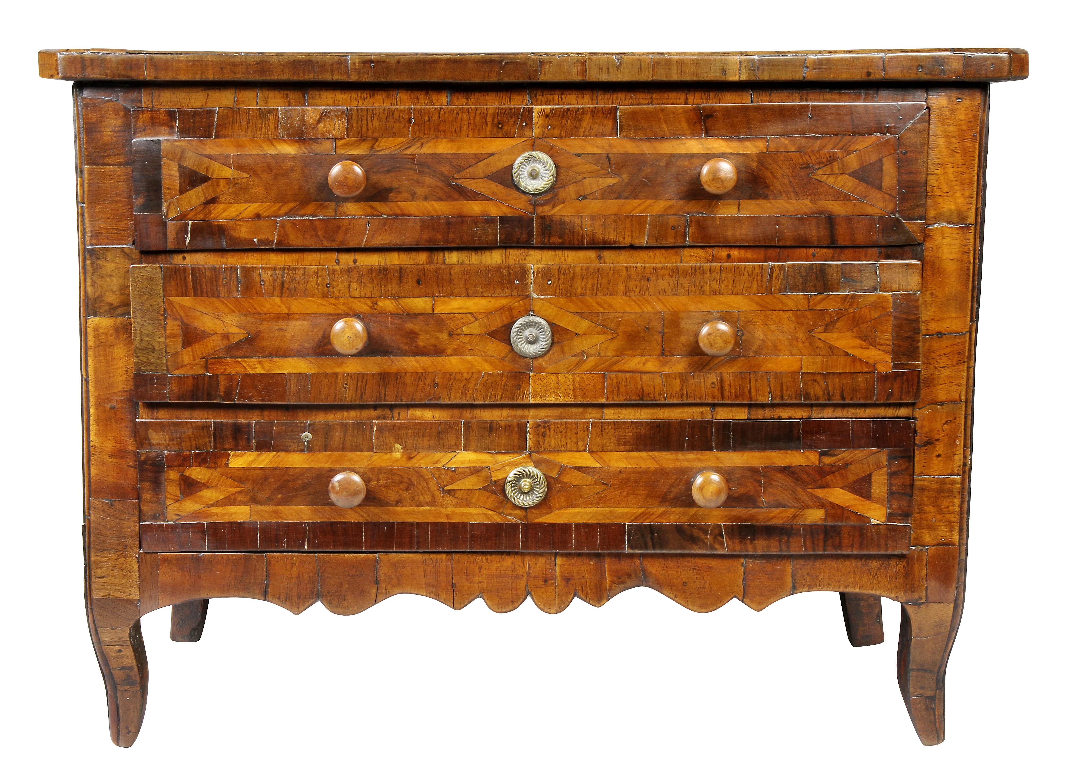 Rectangular top with diamond inlay over three drawers with similar inlay, slight cabriole legs.