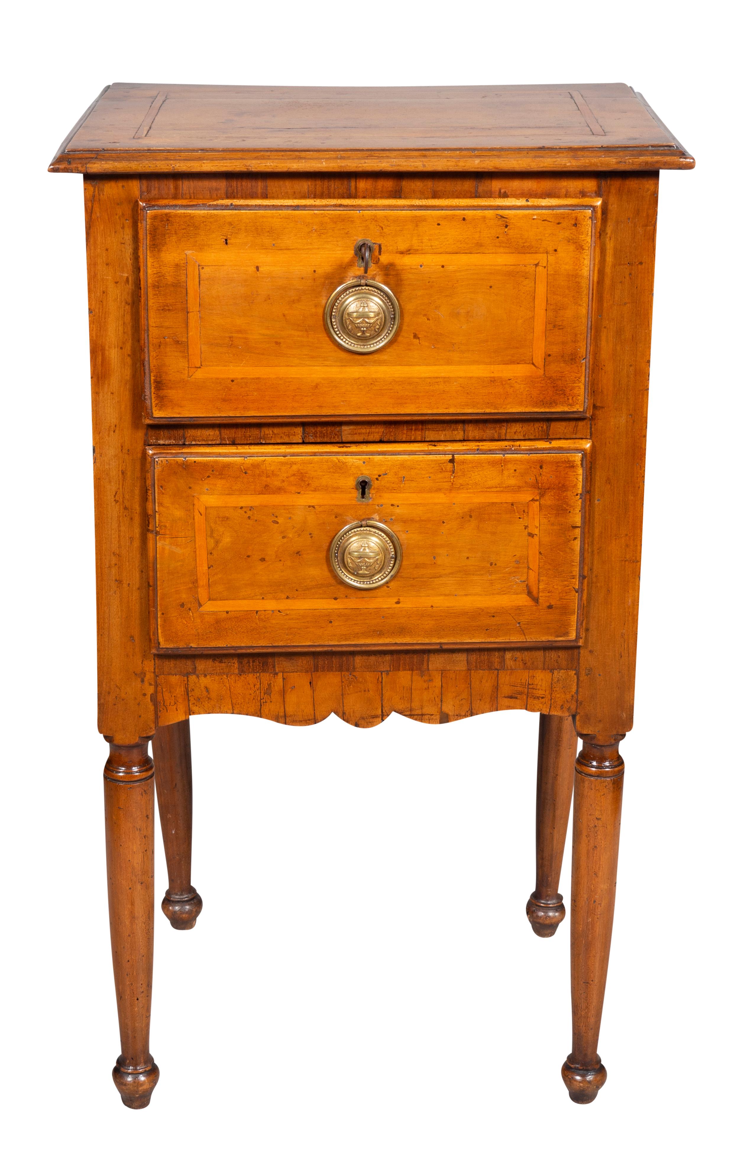 Rectangular top over two drawers with inlaid border and brass handles raised on circular tapered legs.