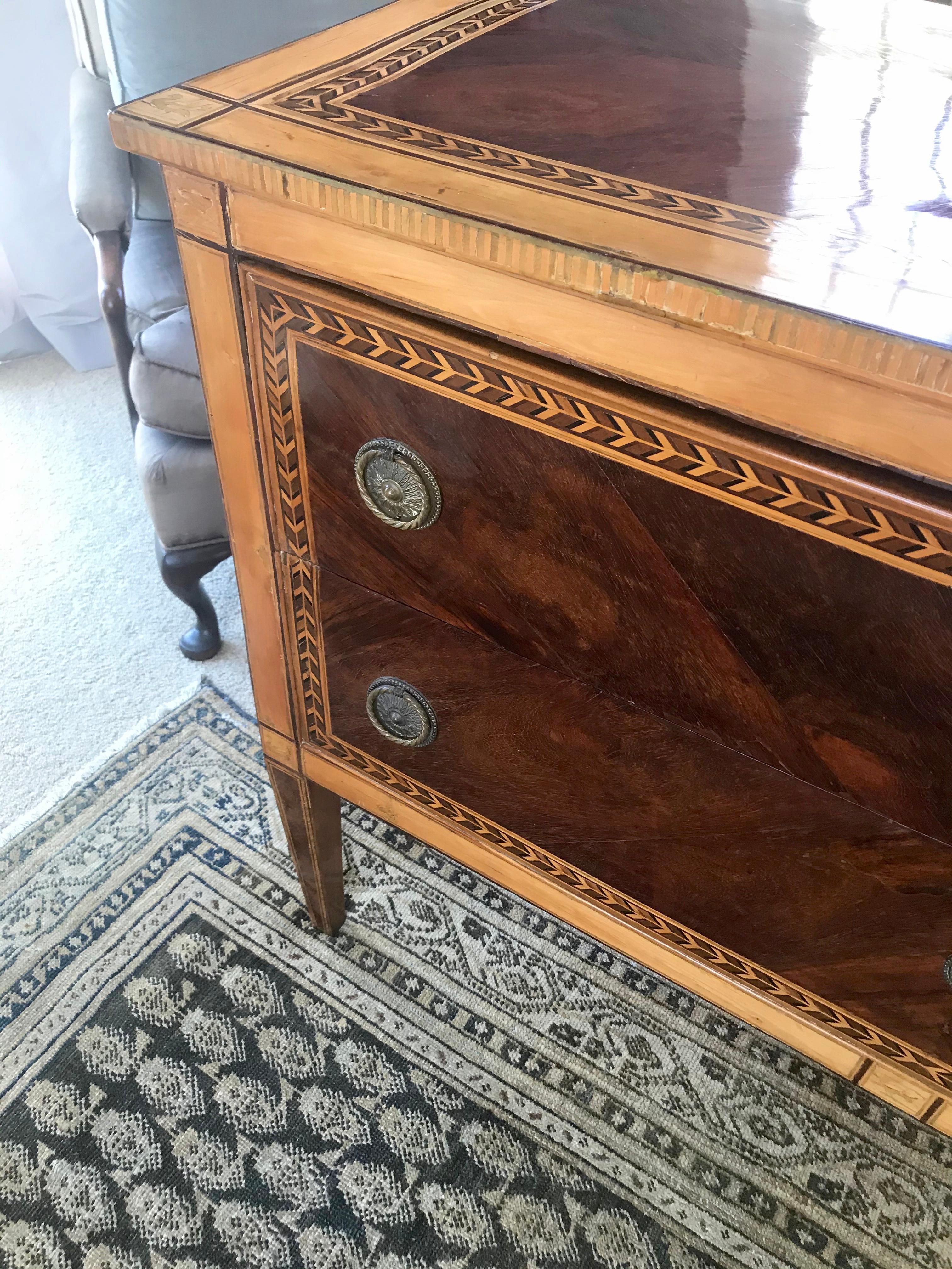 Italian neoclassical lemonwood and amaranth chest of drawers commode. Italian neoclassical chest of drawers Louis XVI antique commode in beautifully patinated amaranth and lemonwood marquetry inlay with birds, ducks and butterflies; refurbished with