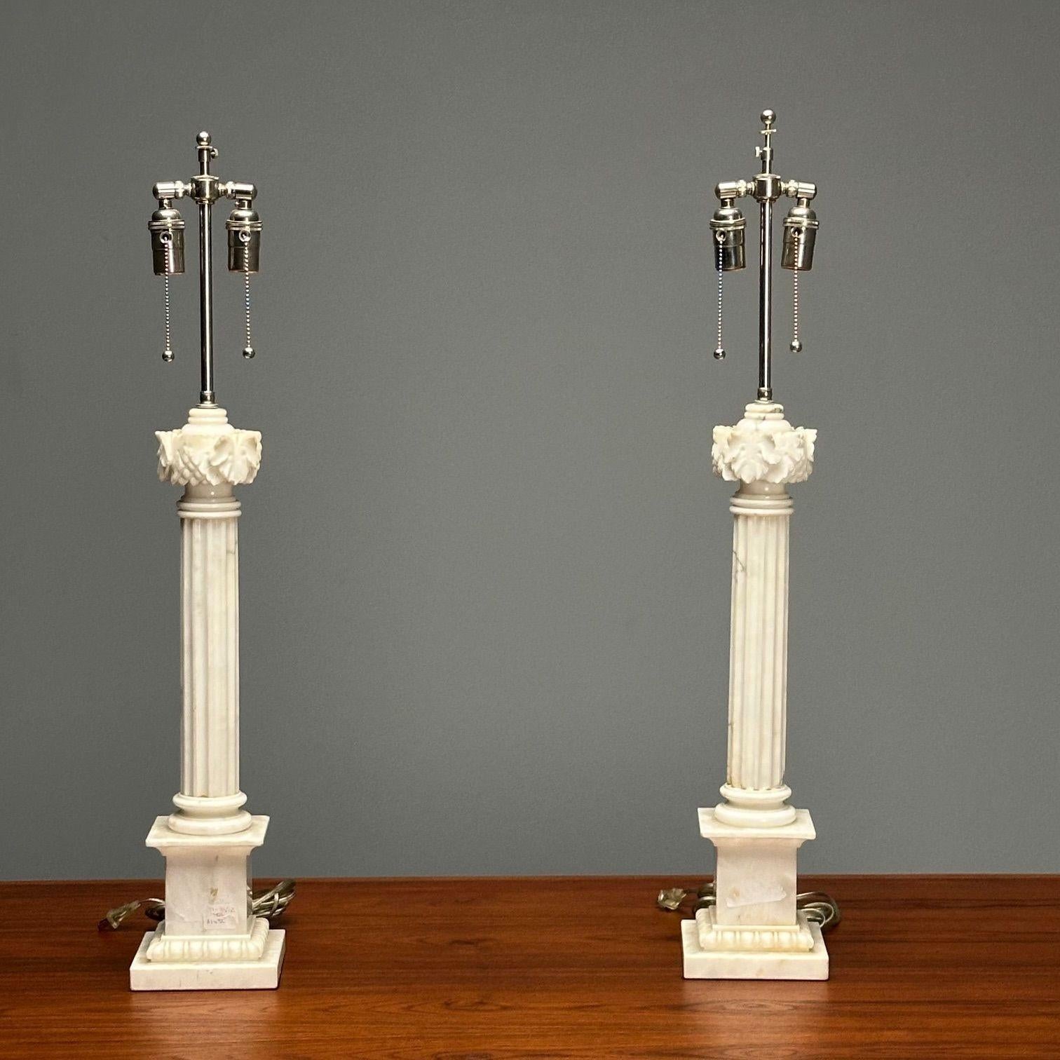 Italian Neoclassical, Corinthian Column Form Table Lamps, Marble, Italy, 1950s

A pair of heavy, solid marble, Corinthian Column form table lamps. One has a small and insignificant chip on the base.
Lamp shades not included.

Marble, Chrome
Italy,