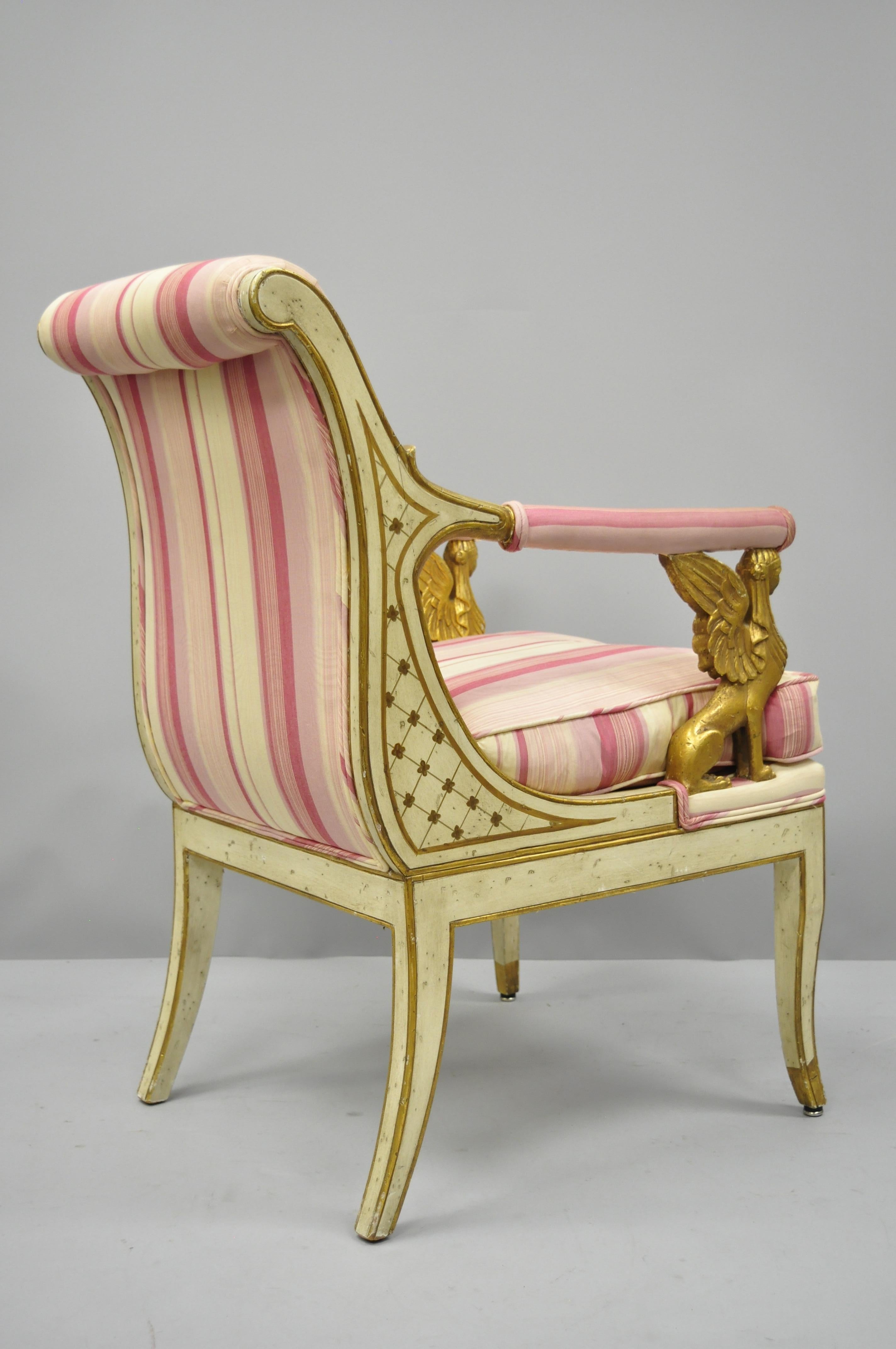 Italian neoclassical cream and gold parcel gilt armchair with winged maiden griffins. Item features carved and parcel gilt figural winged female griffins, rolled back, solid wood frame, upholstered seat, distressed finish, shapely saber legs, and