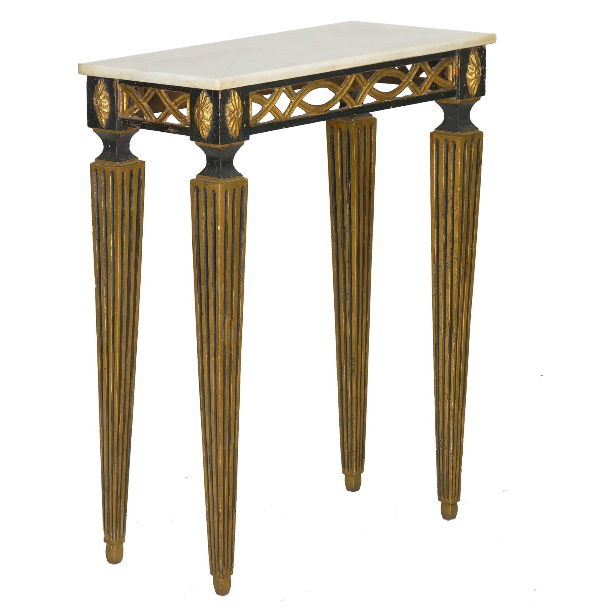 A petite console table with bold design, there is a strength in the presence of oversized legs that offsets the delicate nature of the pierced apron. The effect is quite striking and typical of the Italian taste for the vigorous and whimsical in