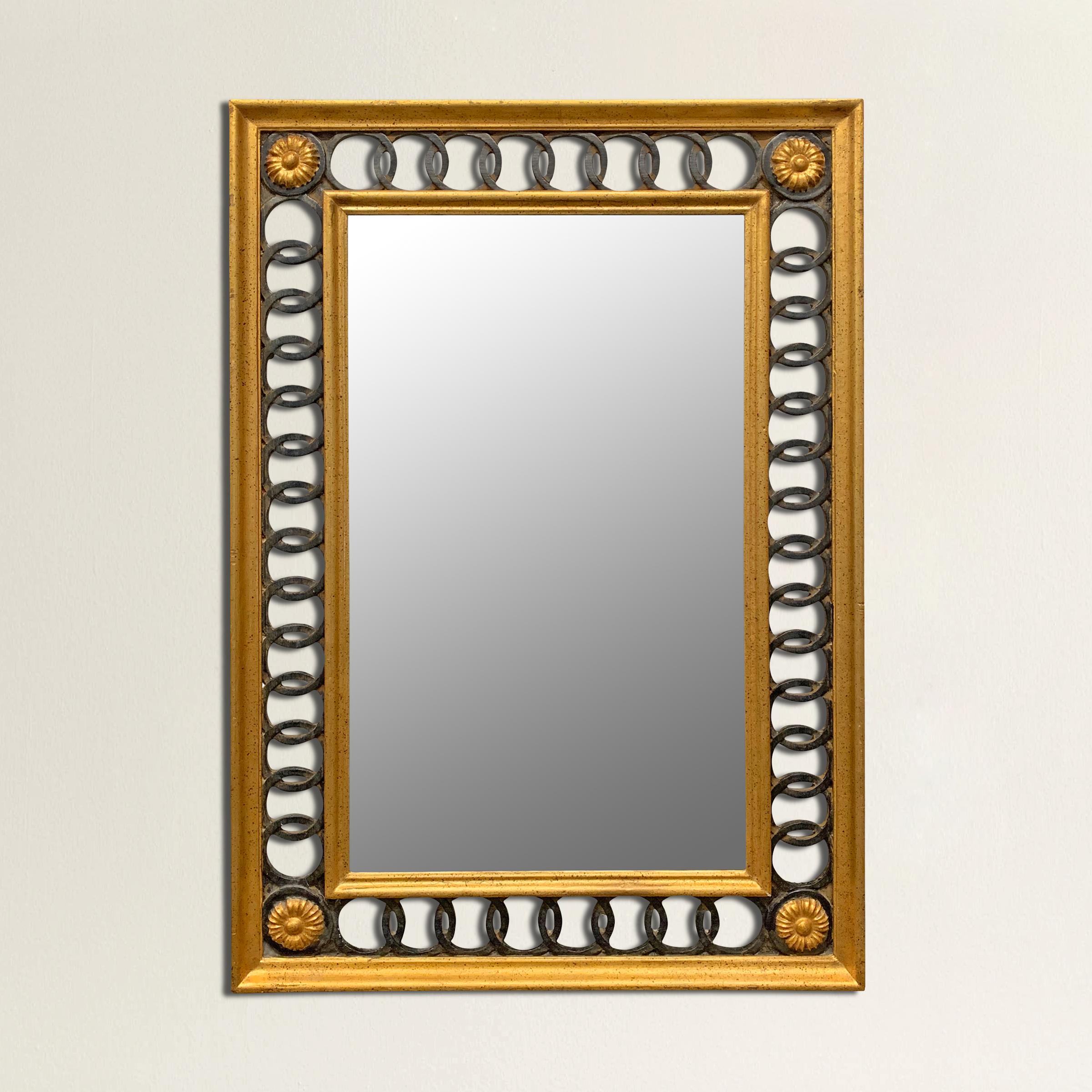 A wonderful mid-20th century Italian neoclassical style framed mirror with gilt and painted carved wood interlocking rings and large flower in each corner.