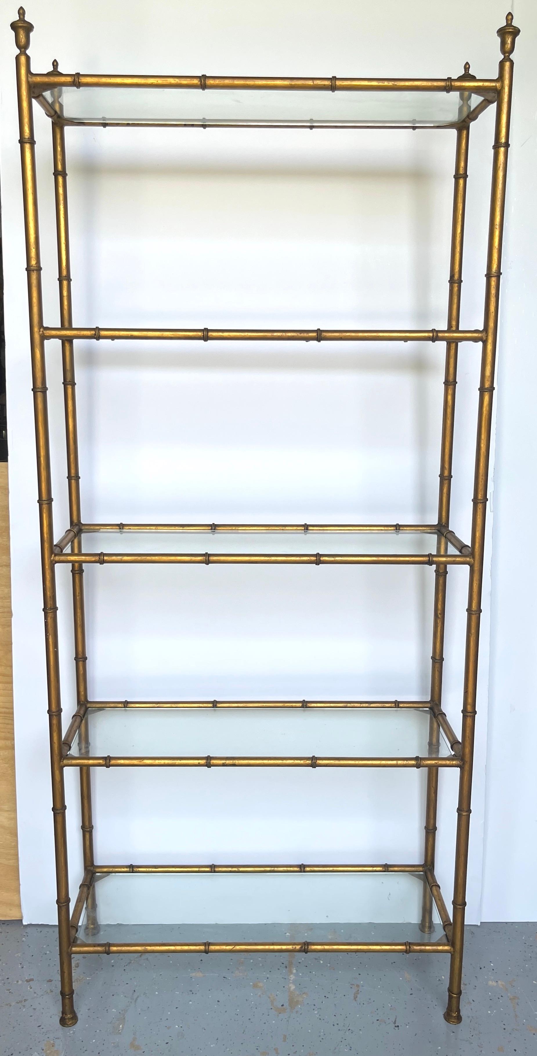 Italian Neoclassical Gilt Faux Bamboo 5-Tier Etagere with Urn Finials, C. 1960s

Experience 1960s Italian Neoclassical elegance with this striking gilt faux bamboo 5-tier etagere adorned with  urn finials, dating back to the 1960s. Standing tall and