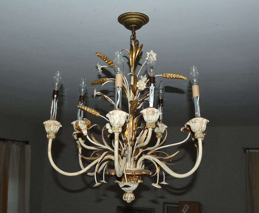 A handsome and romantic Italian neoclassic style, 1940s gilt carved wood and tole six scroll arm decorated with carved wheat hanging light fixture or chandelier of gilt metal, featuring a wheat sheaf design and cream white paint with gilt