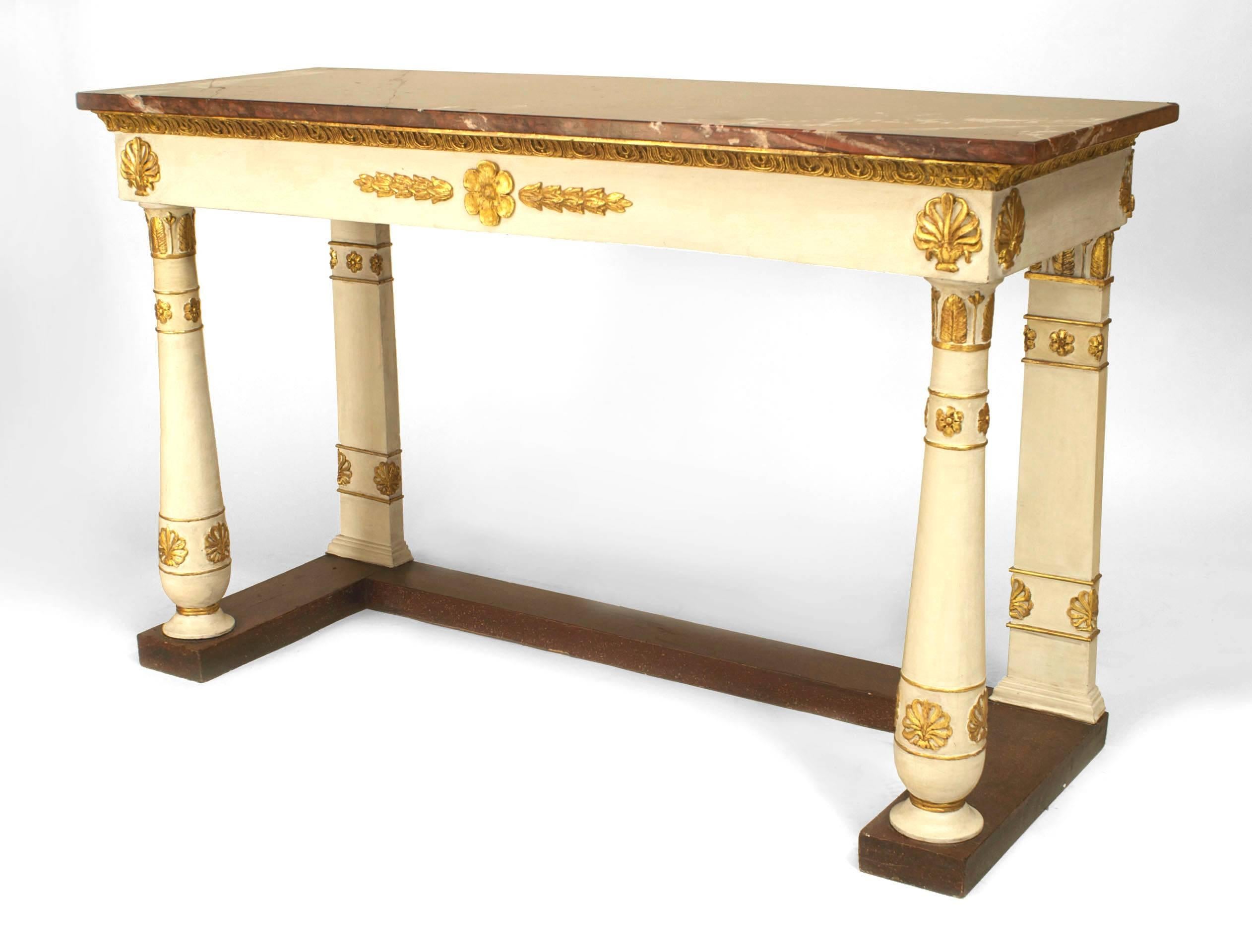 Italian Neo-classic (18/19th Century) white painted and gilt carved trim console table with a faux porphyry painted platform base and a rouge marble top.
