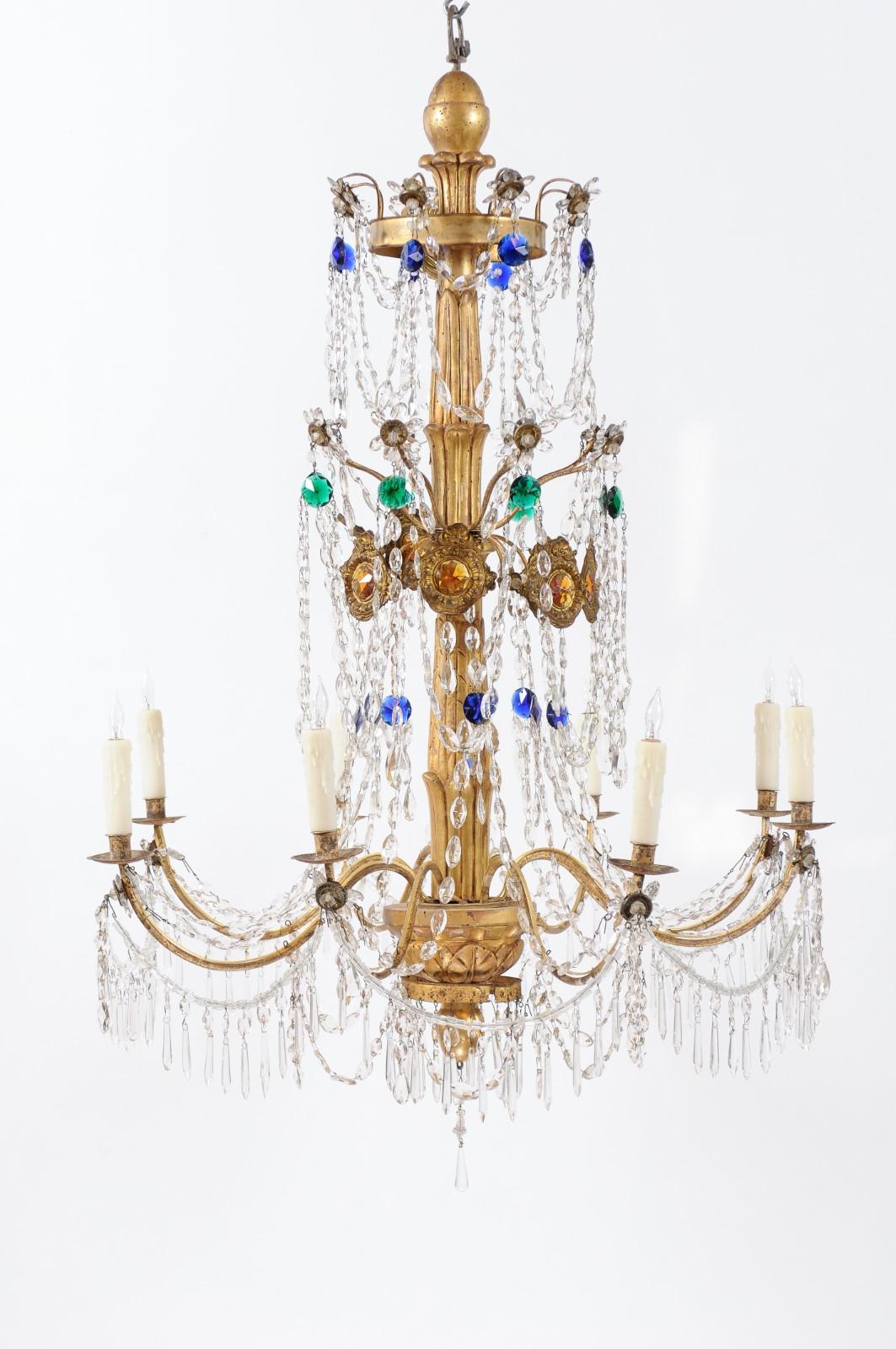 A late 18th century Italian neoclassical giltwood and crystal 8 light chandelier with colored glass pendents.