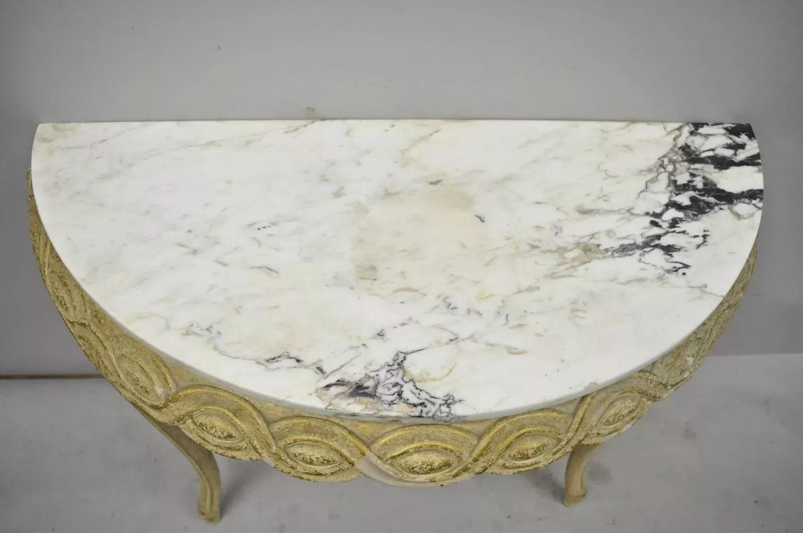   Italian Neoclassical Half Round Demilune Marble Top Ribbon Carved Console Table. Item features a  wall mounting console, interlocking ribbon carved skirt, distressed gold gilt finish, solid wood frame, nicely carved details, cabriole legs. Circa