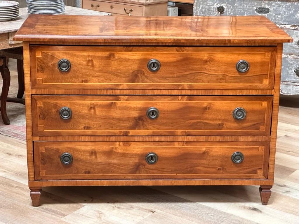 Italian Neoclassical inlaid chest, 19th Century, Walnut Three Drawer Chest, with parquetry inlaid top and drawer fronts, round brass drop bail pulls and brass escutcheons, set on square tapered legs, 33 1/2