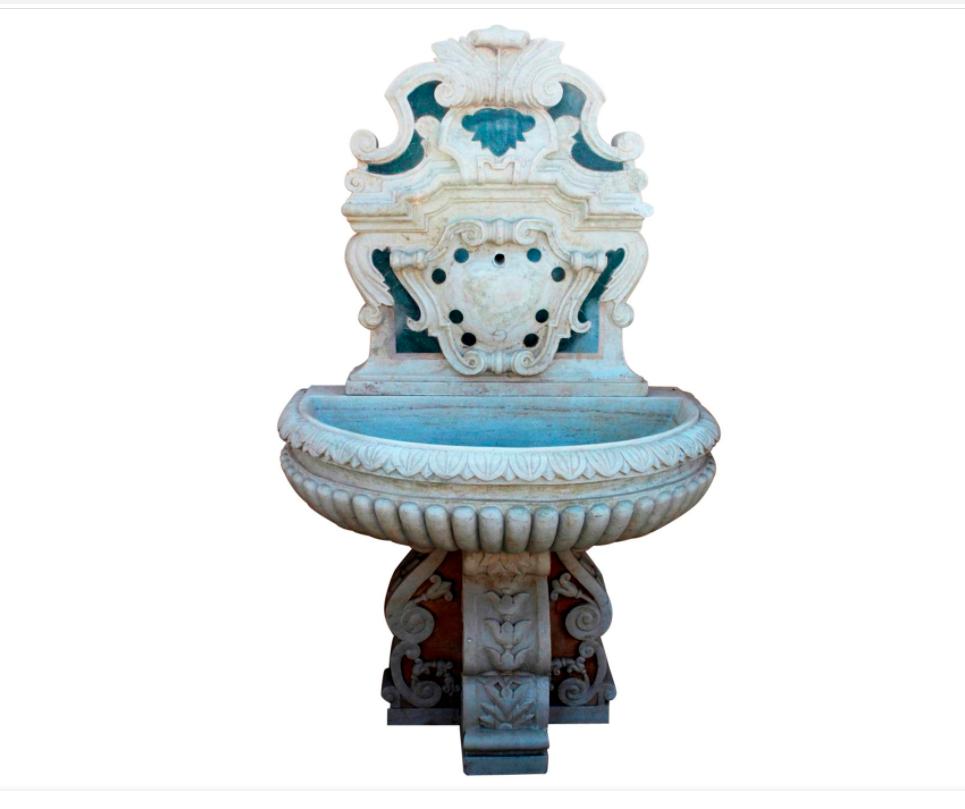 Italian neoclassical marble fountain with serpentine green and other marbles inlays. 

Three piece set composed of a base, tier and front, to be placed on a wall. 

We can modify it to clients specifications and arrange guaranteed crated delivery.