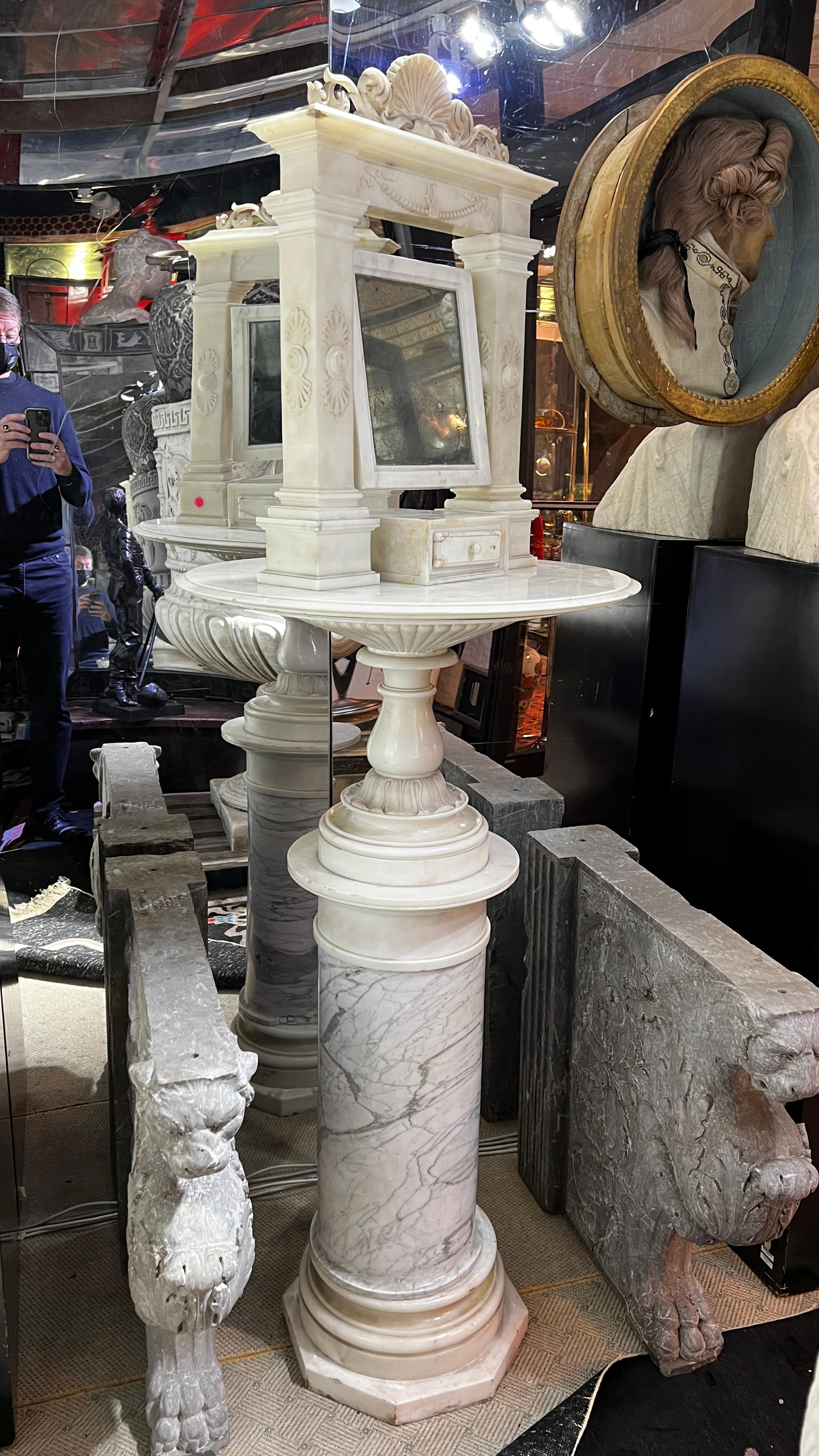 Our shaving mirror in the neoclassical style was crafted in Italy from carved marble, circa 1810. The only all-marble standing mirror of its kind we have seen come to market in the past twenty years. Exceptionally rare. Apparently unsigned.

There
