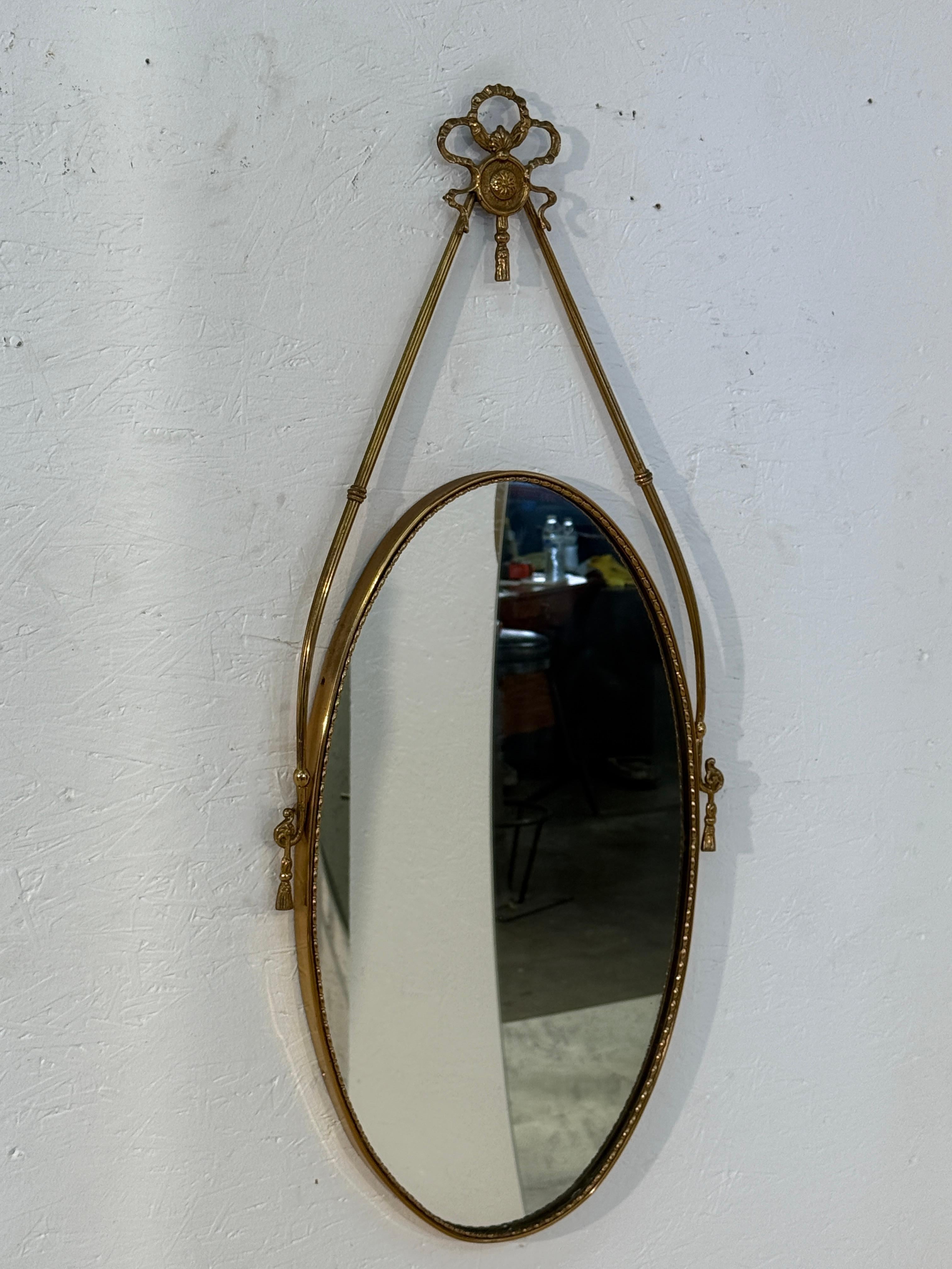 Moderno Italian Neoclassical Oval Mirror with Brass Ribbon and Tassel Detailing, 1950s in vendita
