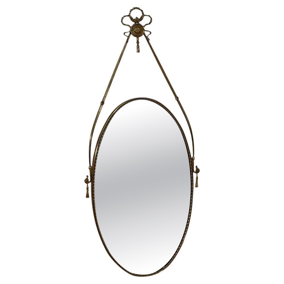 Italian Neoclassical Oval Mirror with Brass Ribbon and Tassel Detailing, 1950s