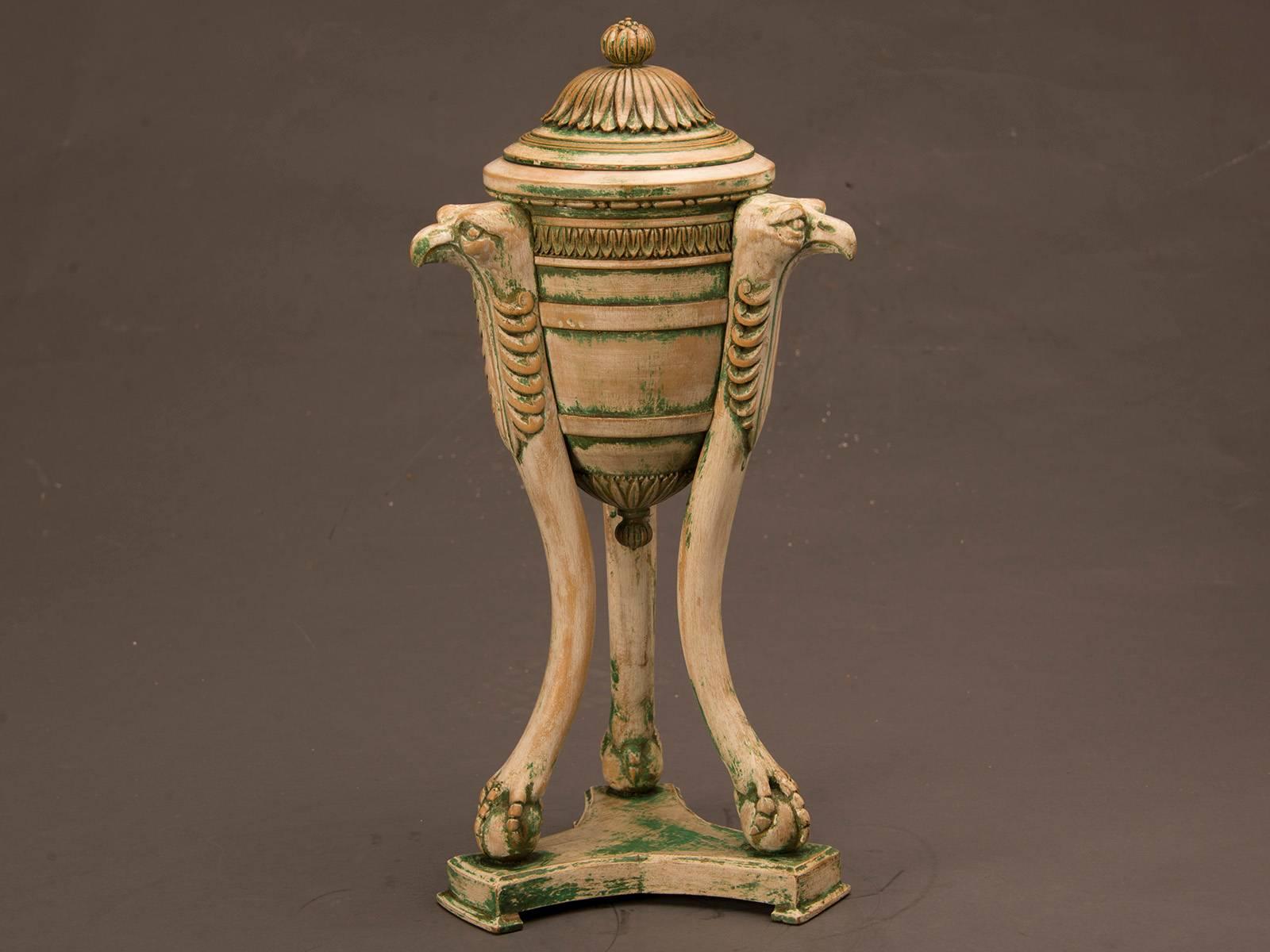 This striking neoclassical antique Italian painted urn vessel circa 1870 possesses an architectural grandeur unusual for its scale. The triangular base supports a trio of shaped bird legs each grasping a sphere symbolizing the Pearl of Wisdom or the