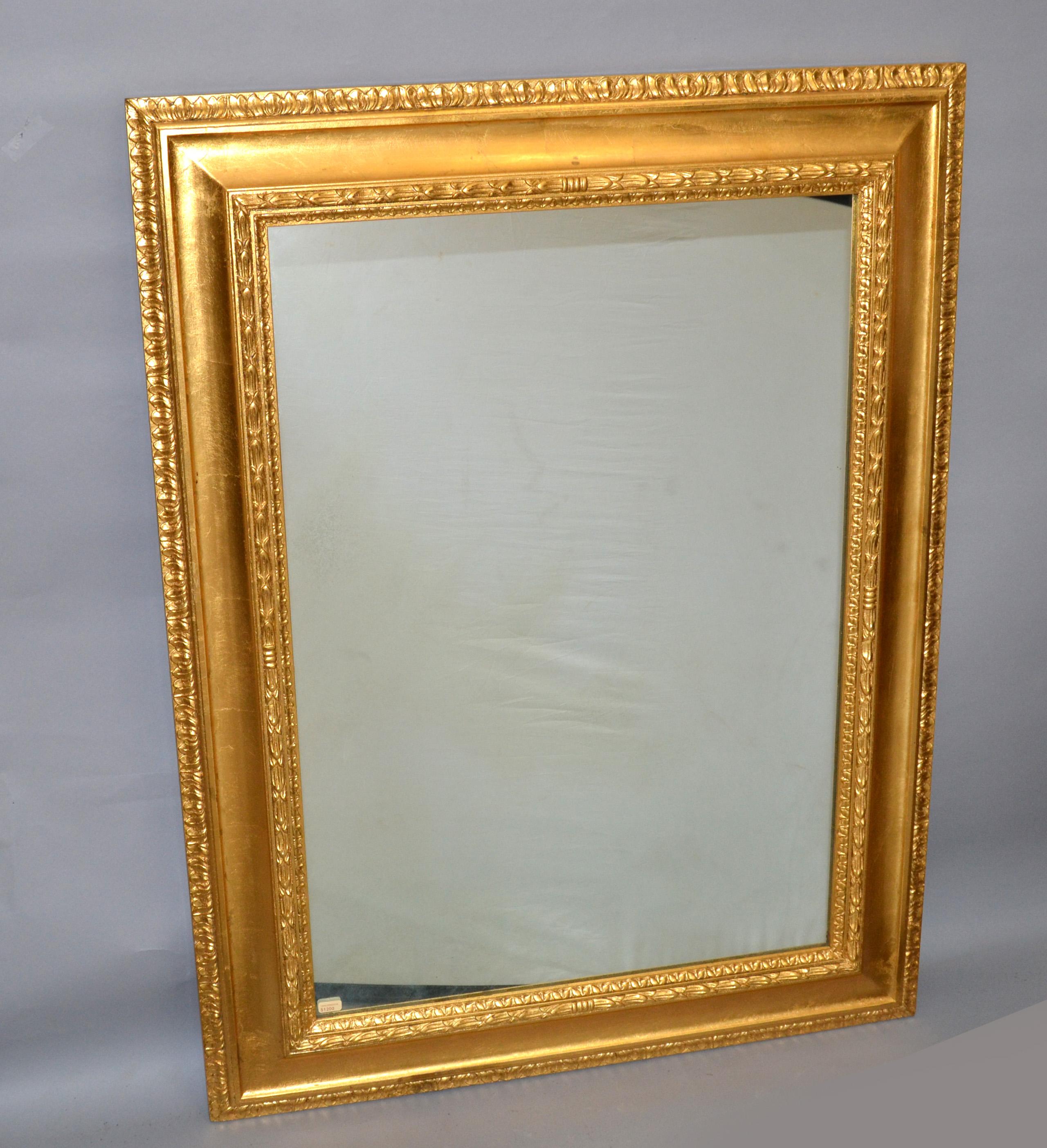 Neoclassical Regency rectangle Gilded wall mirror with fine detailing in the frame, made in Italy, 1930.
The Backing is solid wood, and it has some weight to it.
Can be hung securely with the wire in the back.
Some foxing to the Mirror