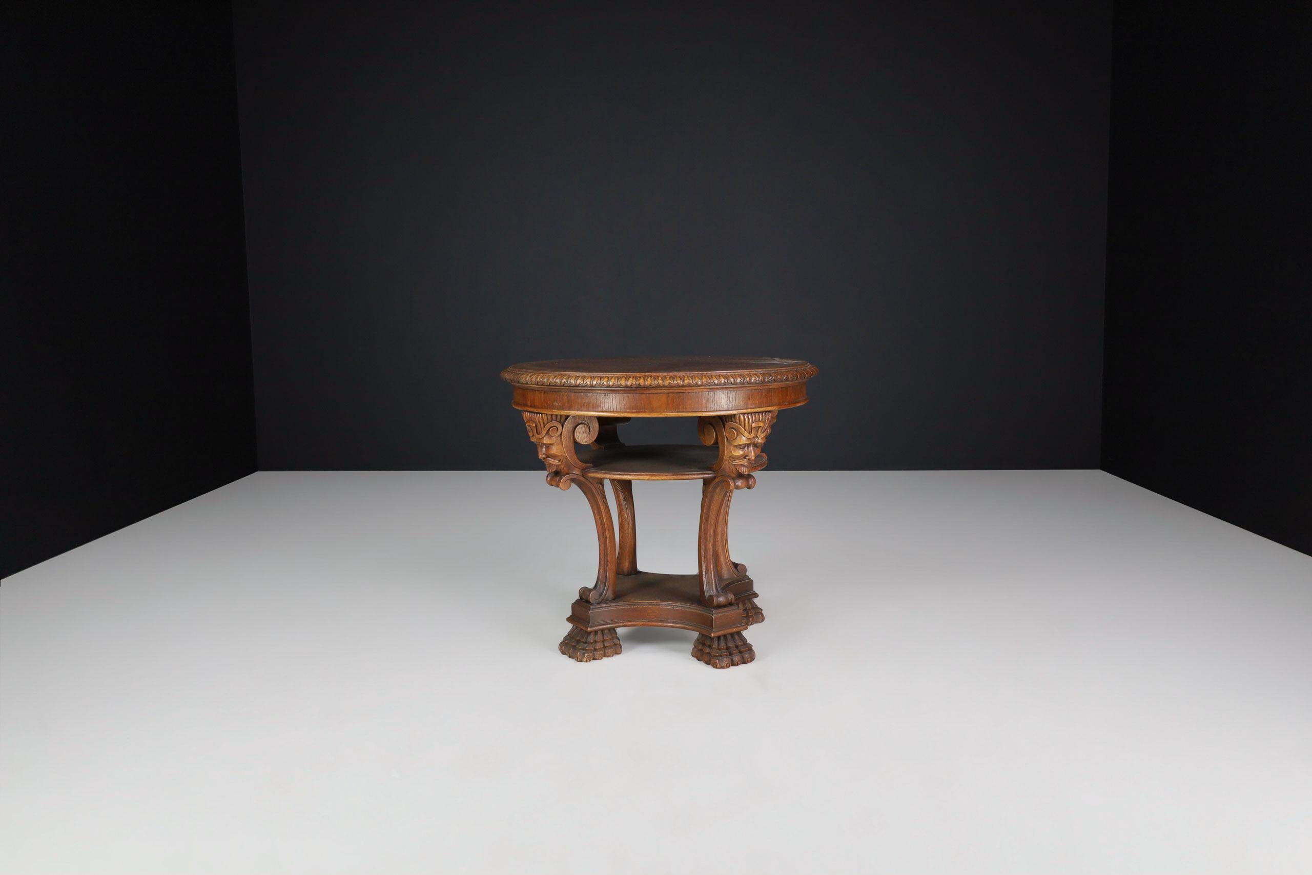 Italian Neoclassical Round Walnut Center Table with Carved Figural Legs, Italy, 1920s

A refined Italian neoclassical-style center table crafted in Italy during the 1920s. Executed in solid walnut with a rich burl wood top, this round table exudes