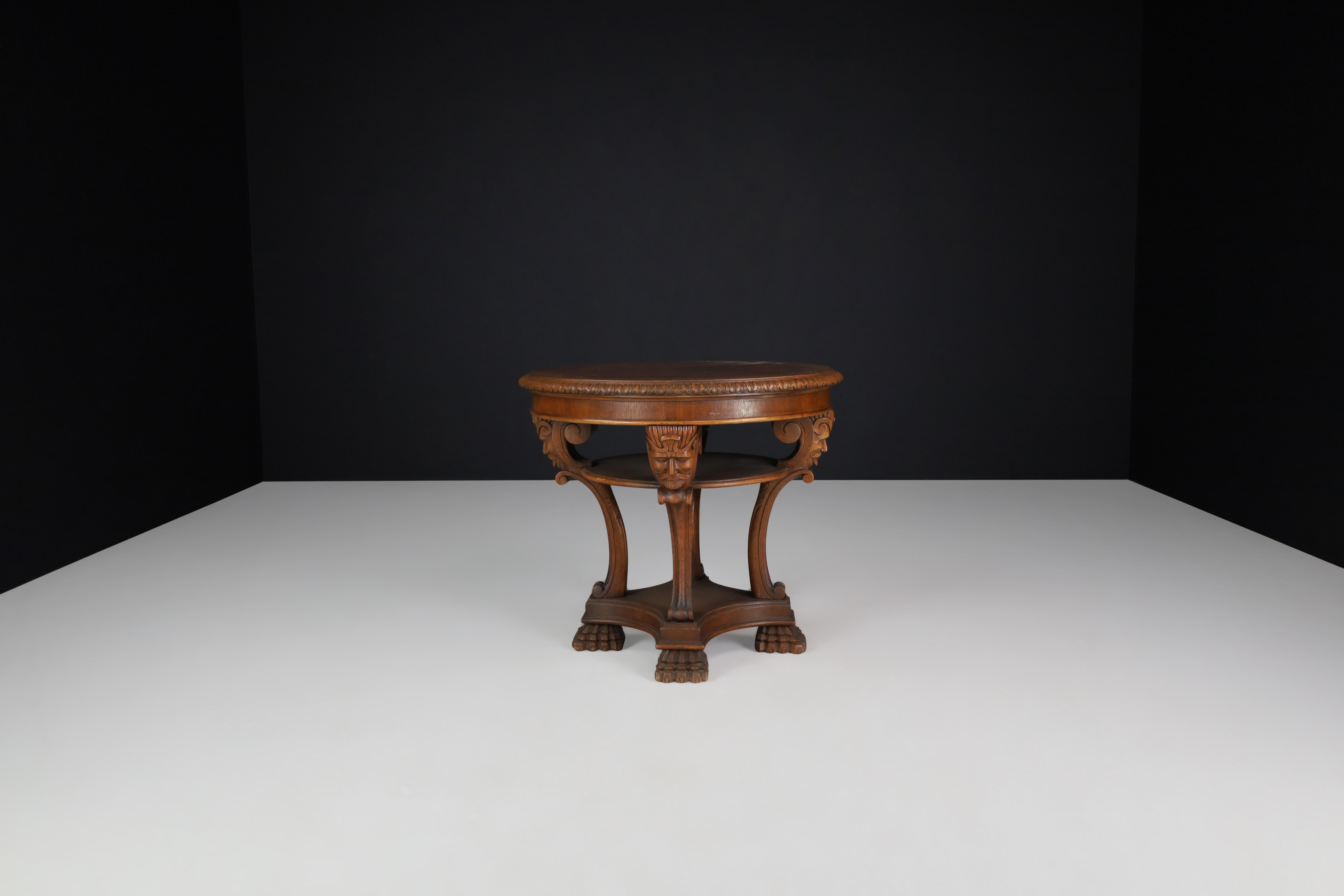 Early 20th Century Italian Neoclassical Round Walnut Center Table with Carved Figural Legs, 1920s For Sale