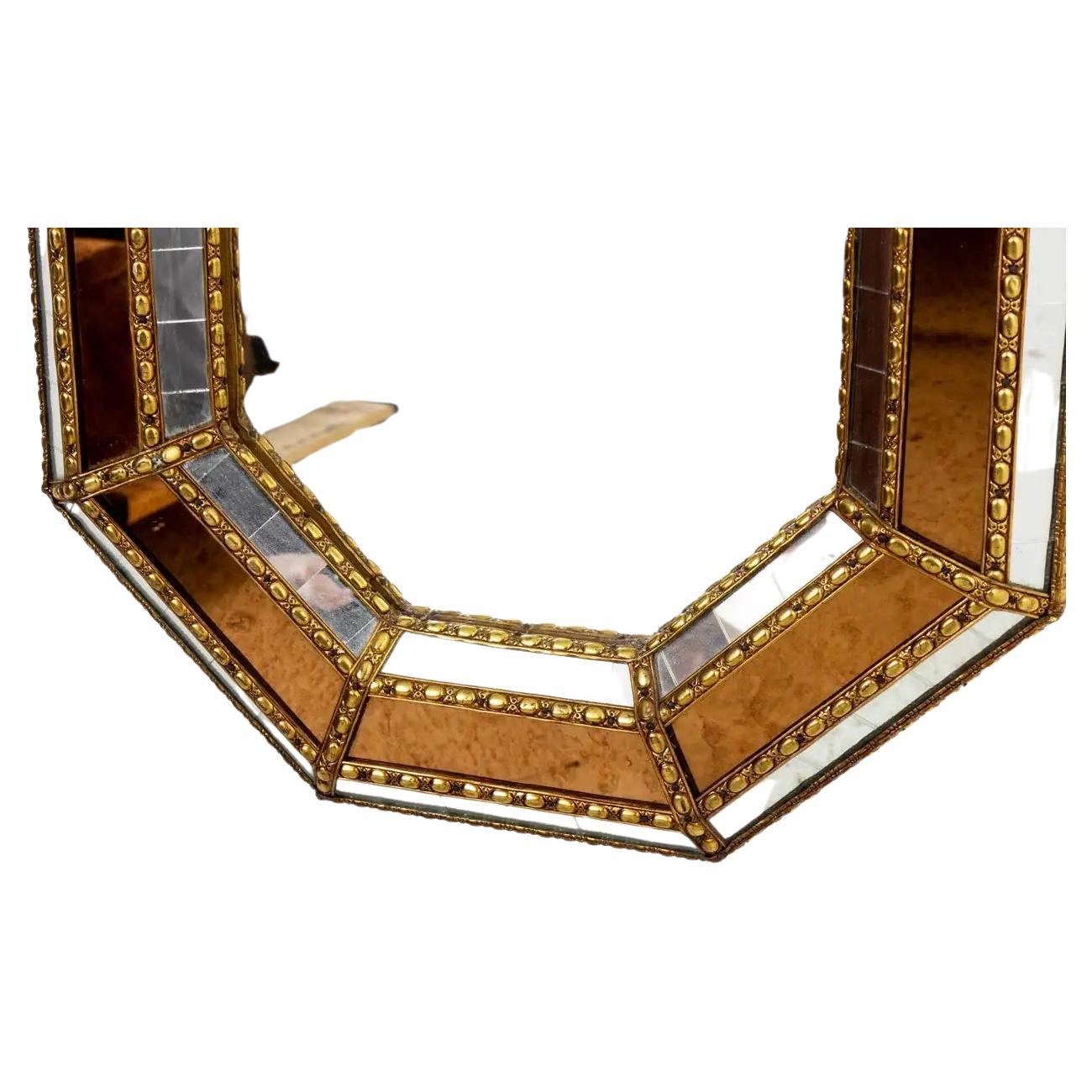 Circa 1960s Neoclassical style brass ram's head table with oval glass top, bottom cross stretcher, hoofed feet and acorn shaped finial. Good vintage condition. Made in Italy with tag on the bottom. Please note of wear consistent with age. Some