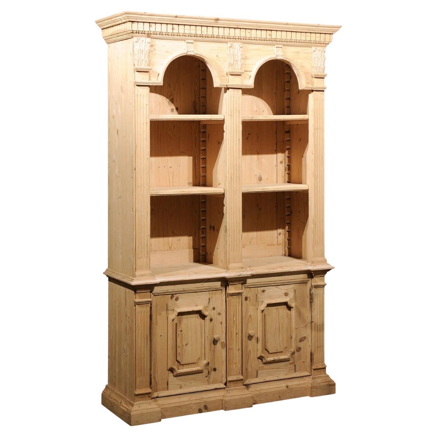 Italian Neoclassical Style Carved Pine Bookcase with Arched Motifs and Capitals For Sale