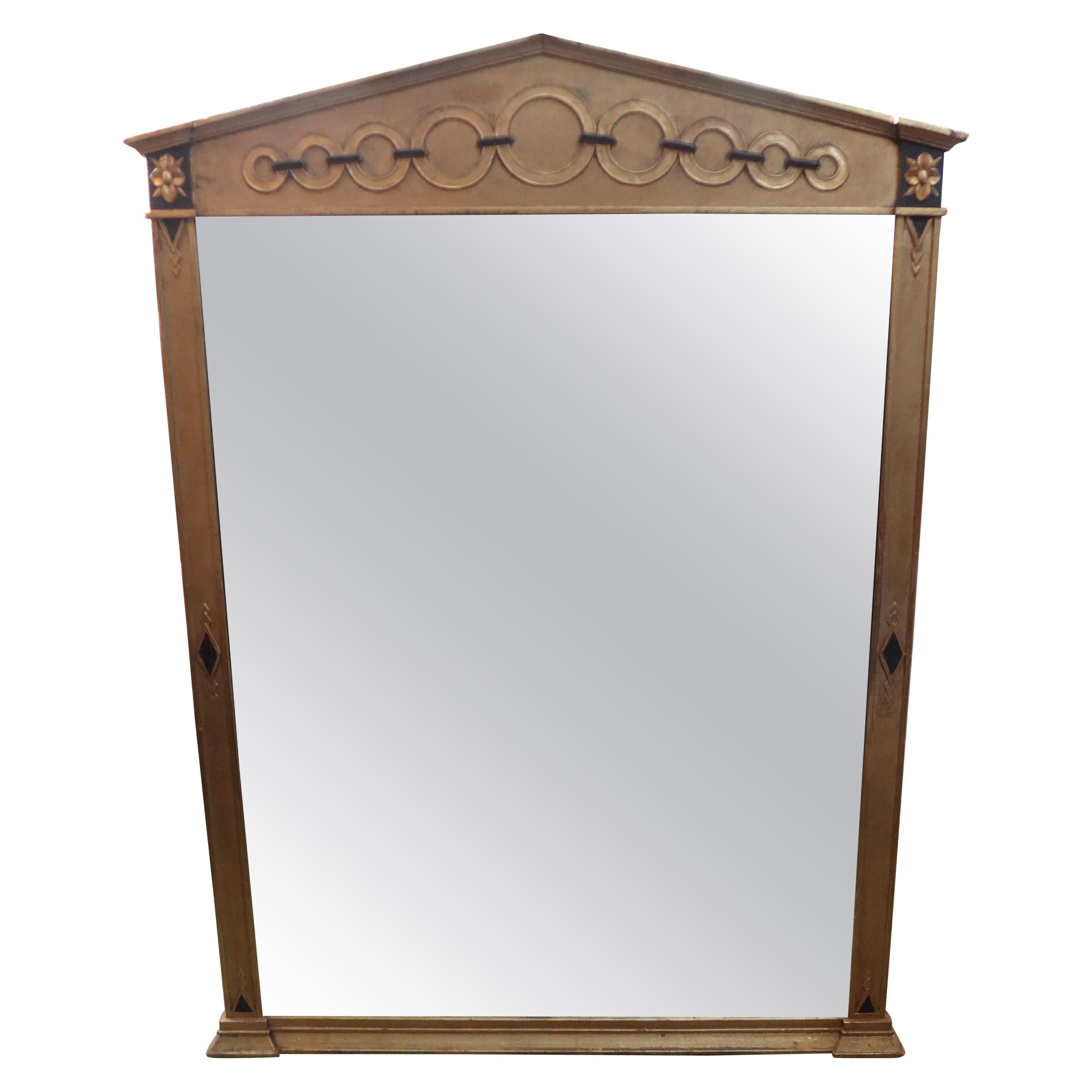 Italian Neoclassical style giltwood mirror.
Stunning vintage Italian Neoclassical style giltwood mirror. This lovely Italian ebonized and gilt wood mirror would look great over a console table, credenza, commode, chest or buffet. Nice patina!
