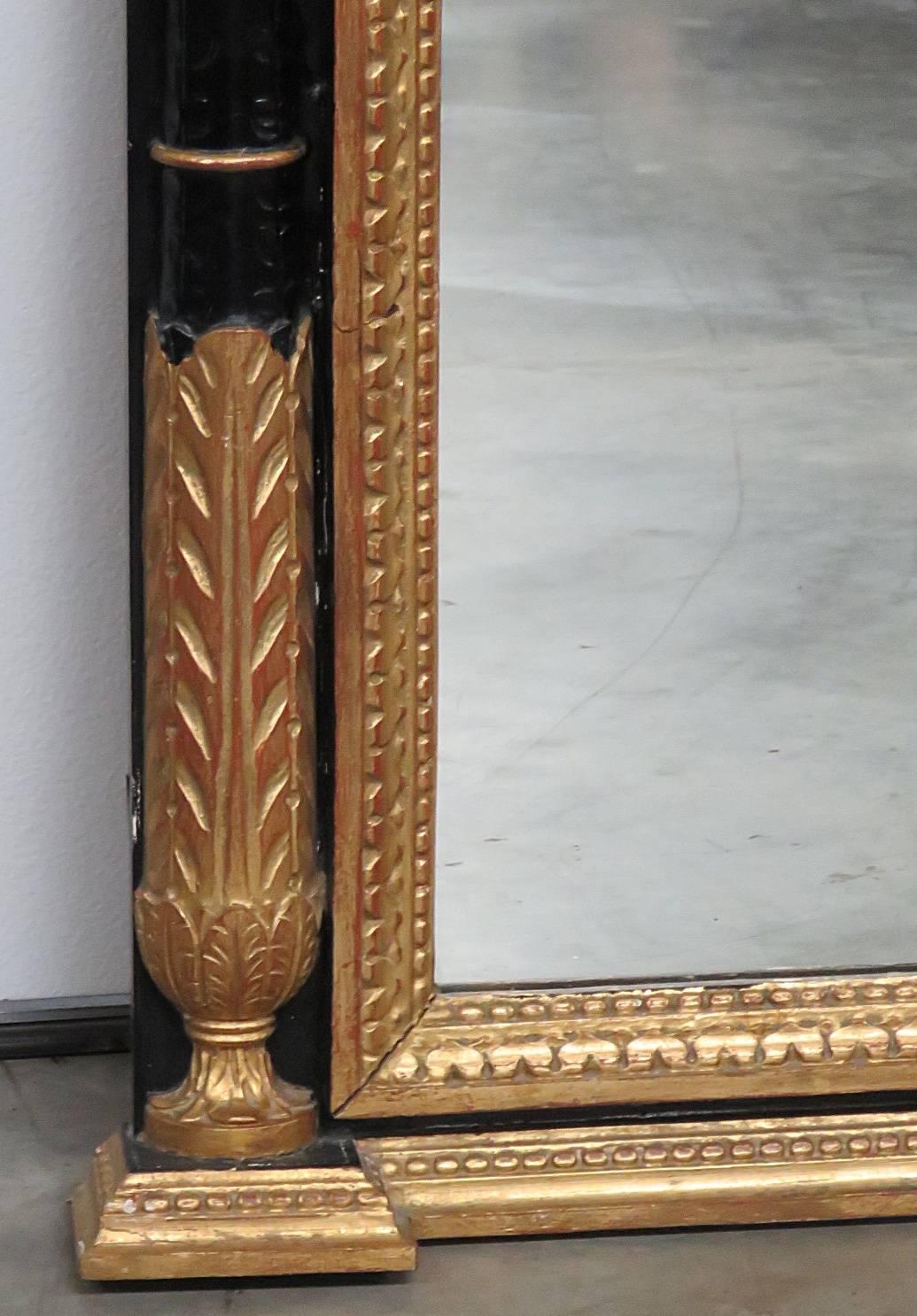 Italian Neoclassical style mirror with gilt accents.