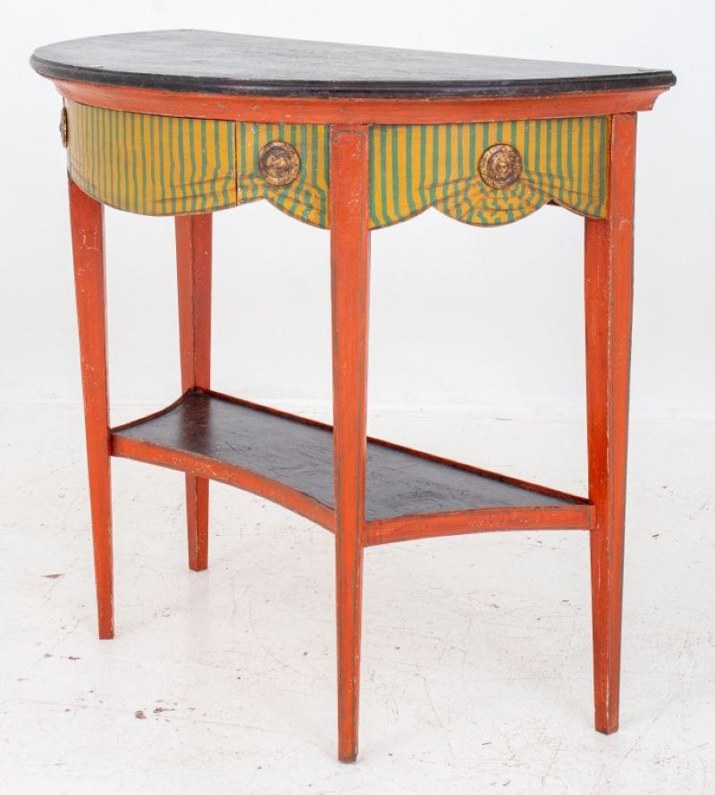 Italian Neoclassical style trompe l'loeil painted demilune console, with typical d-form top in faux jasper stone, above a shaped apron cut and decorated to appear as striped silk skirting held in place by gilded bullions, the legs and other areas