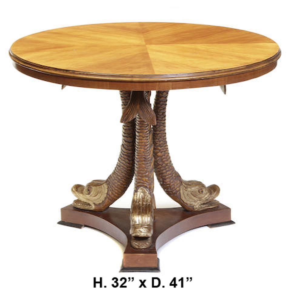 Italian neoclassical style finely carved walnut round pedestal table.
The quarterly veneered round top over three beautifully carved dolphins.
Resting on triangular base with block feet.
First half of the 20th century
Measures: H 32