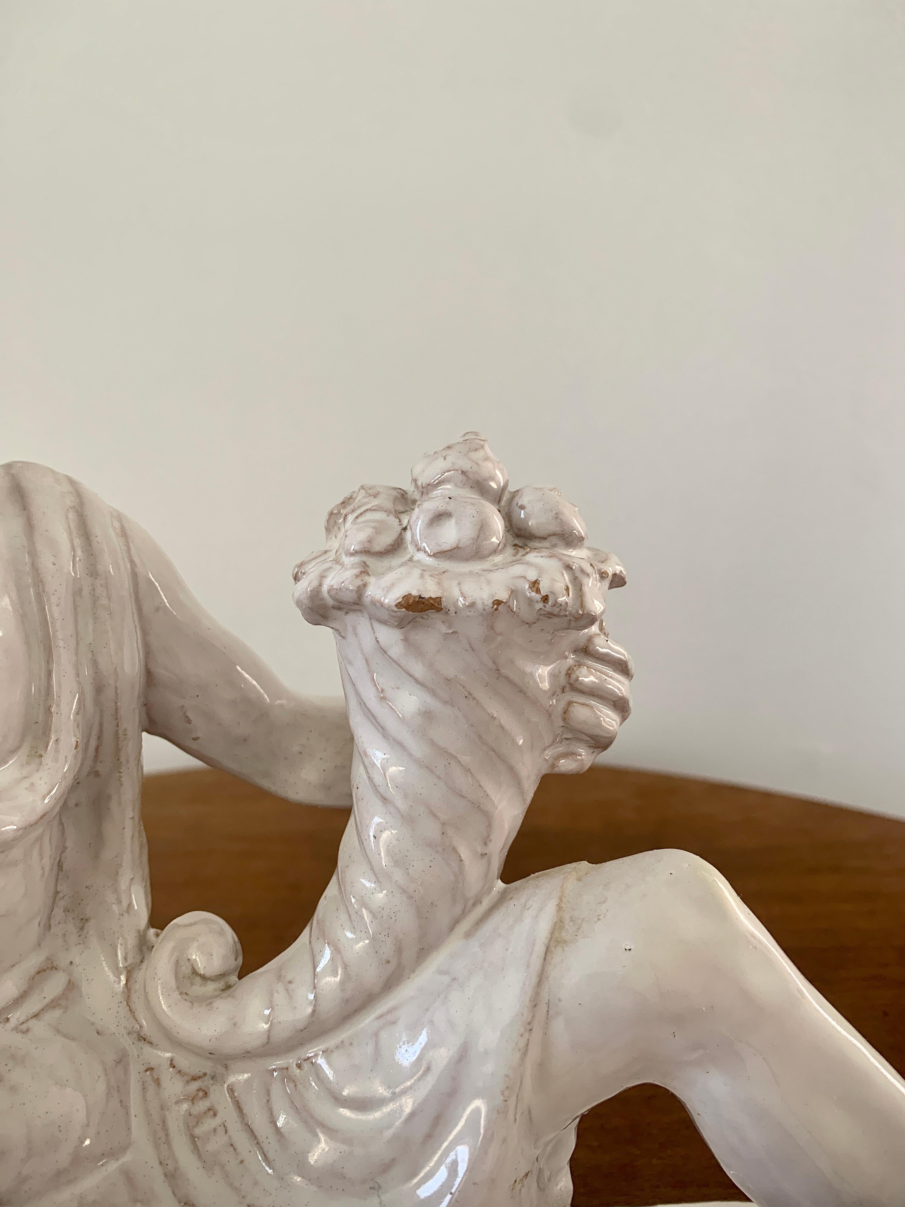 Mid-20th Century Italian Neoclassical White Porcelain Reclining Man with Cornucopia Sculpture For Sale