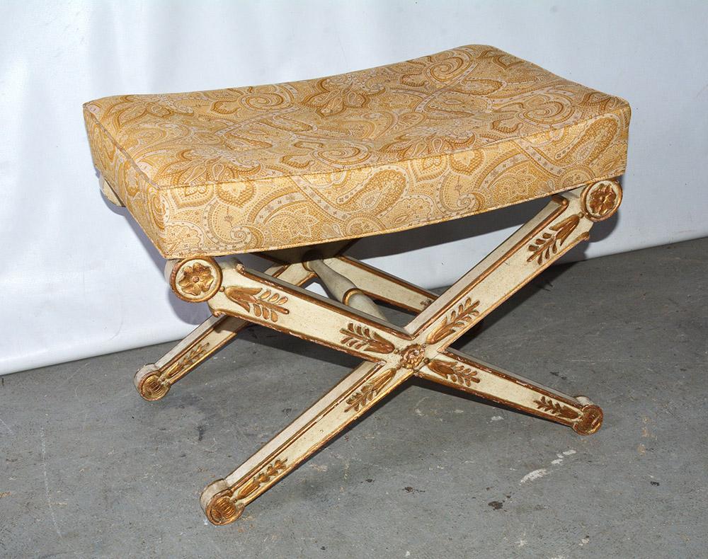 An elegant Italian neoclassical X-form stool painted Ivory and decorated with giltwood floral and vegetal ornaments. The stool has upholstered seat covered in paisley design fabric.

Regency, Empire, neoclassical stool, bench.
 