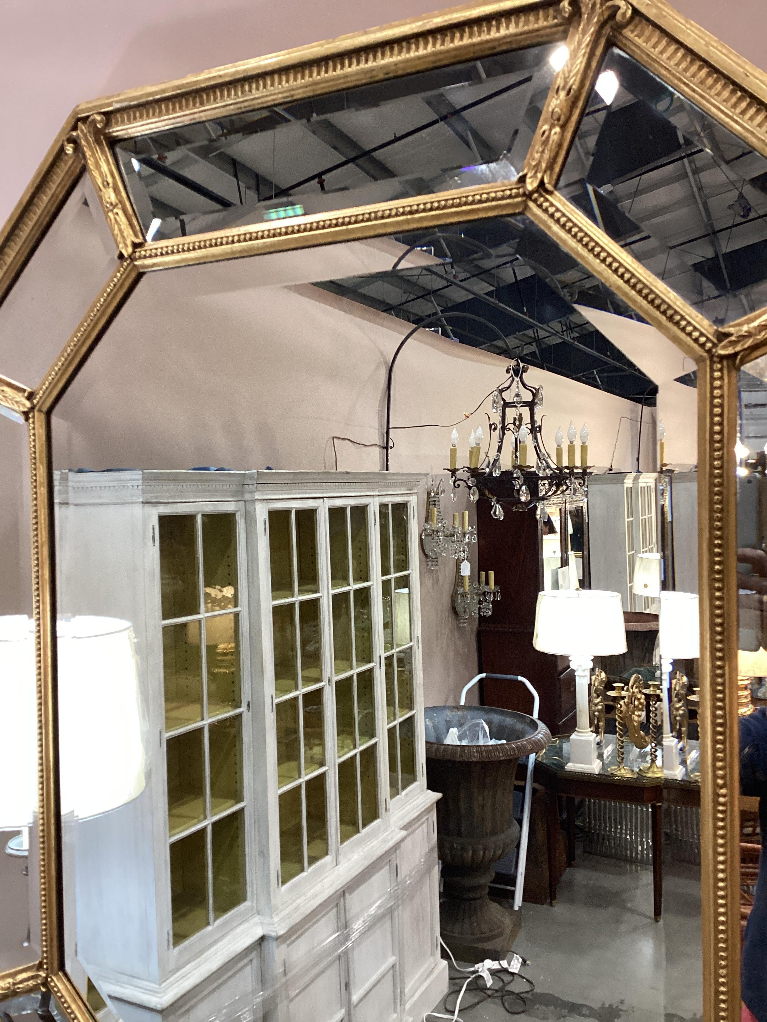 Italian Octagonal Giltwood Beveled Mirror. Central mirror is flanked by individual panels of beveled mirrors. Mirror can be hung vertically or horizontally.