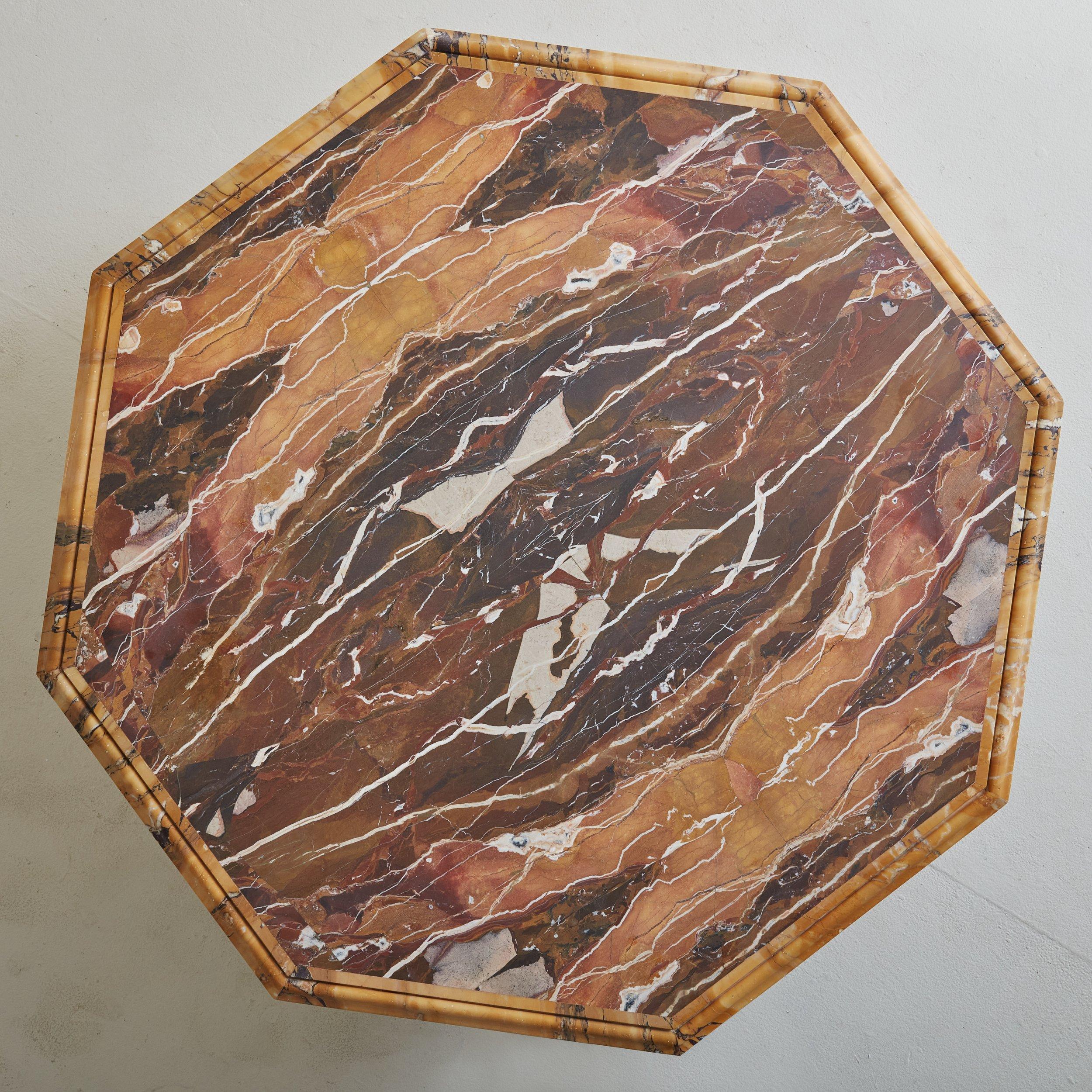An absolutely stunning and rare 19th century honed marble table top featuring hues of purple, yellow, peach and rust. The beveled marble table top rests on an iron base, that appears to have been custom made in the 1960s. 
 

DIMENSIONS: Top: 41