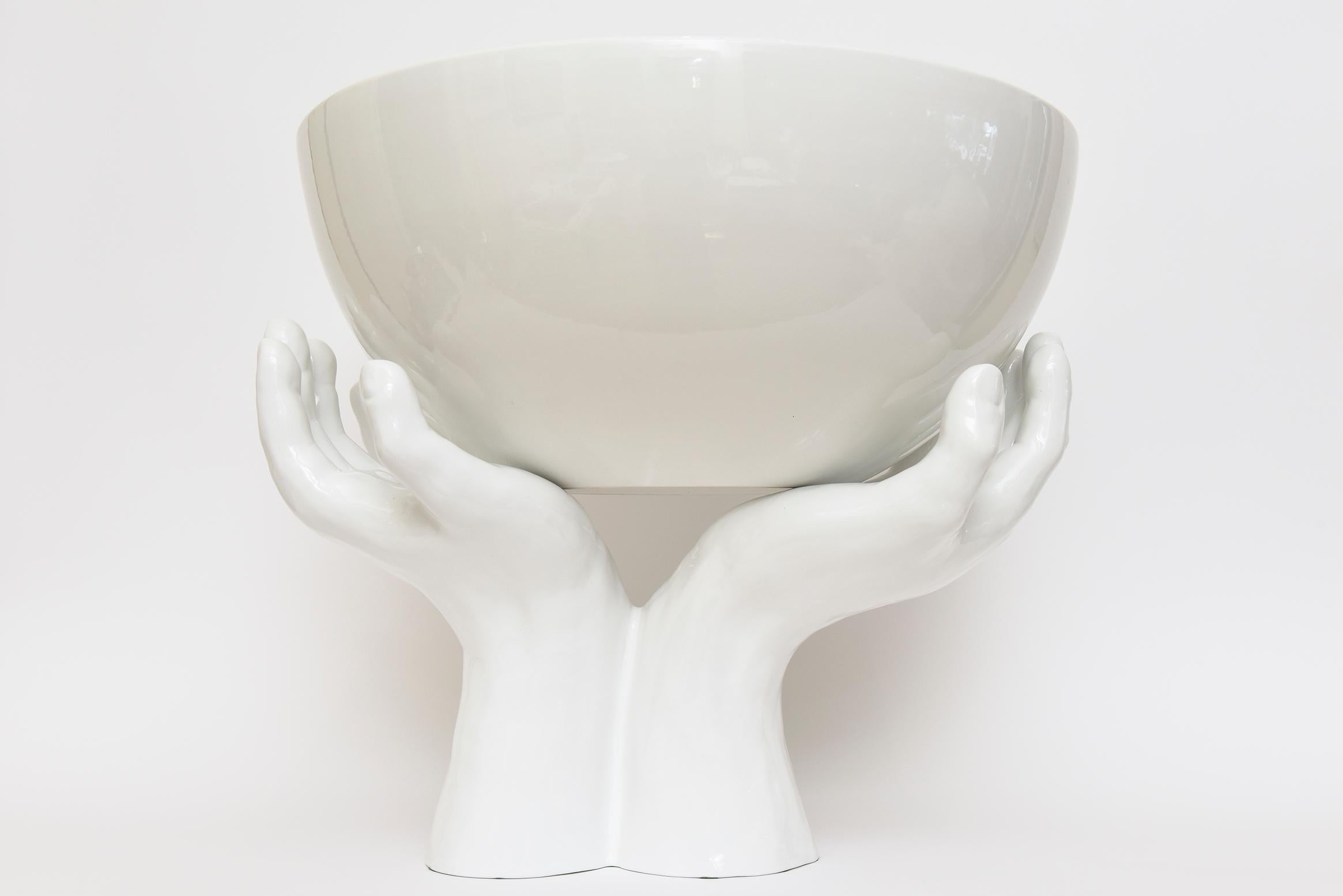 This amazing and very dramatic monumental welcoming 2 part Italian ceramic sculpture is white to off white. The gigantic bowl sits on top of the welcome outstretched hands. We have never ever had this Rare version before and this is from the 70's.