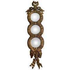 Italian Oil Gilded Three Convex Mirrors Attached to a Bow with Wing 20th Century