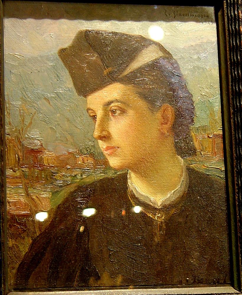 A very attractive Italian oil painting of the head of a young woman. Signed and dated by G. Gianmarco, 1945. Set in French ebonized frame.