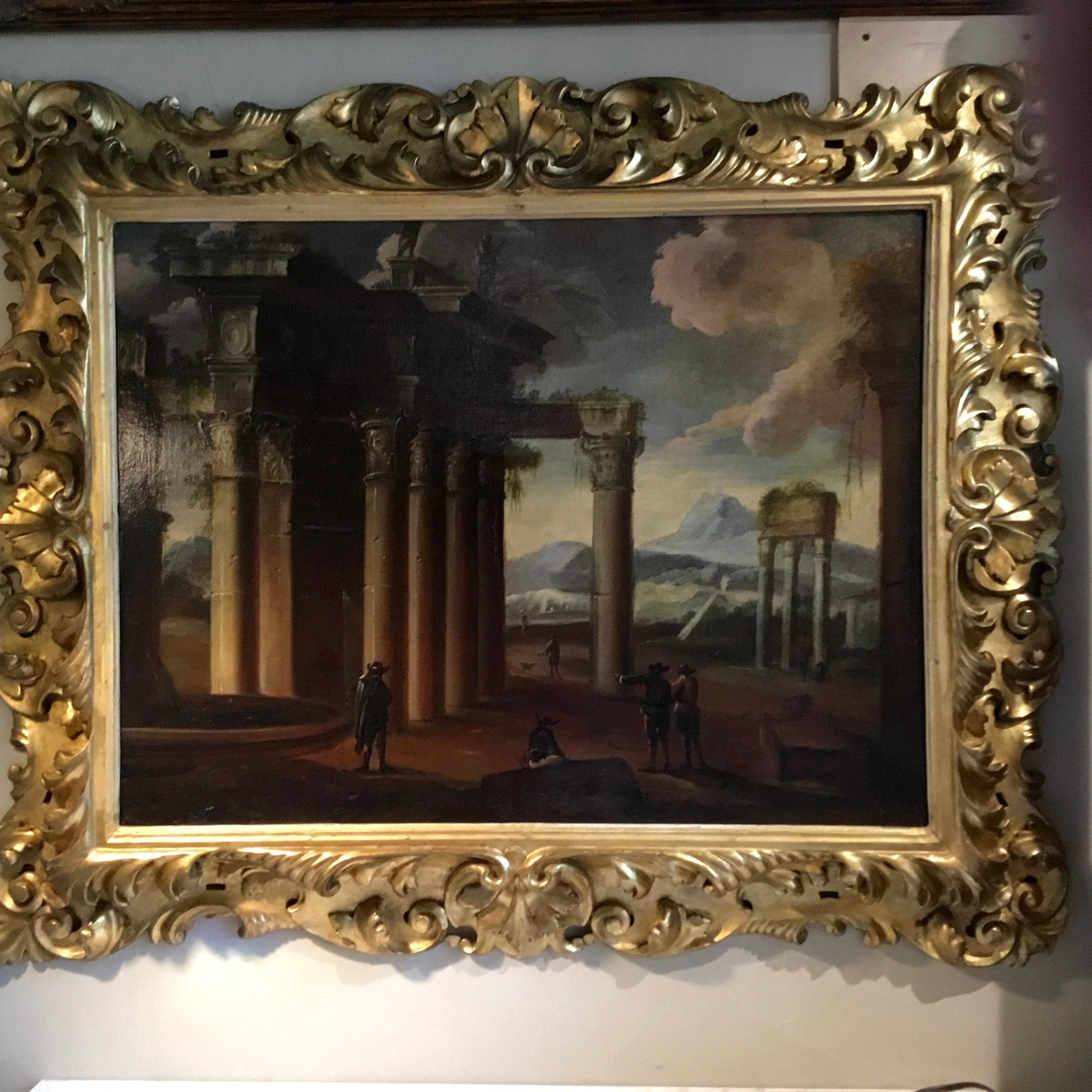 Antique old world setting depicting cavaliers in the foreground with Roman columns.
The background with a body of water and a mountain range in the back. Statues are
above the columns. Unsigned. A beautiful giltwood carved frame makes this special.