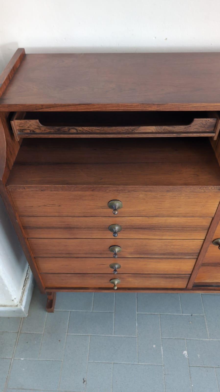 Discover the embodiment of timeless Italian craftsmanship with this refined Sideboard realised by Falegnameria Fainardi, a carpenter’s shop based in Parma (Italy). Designed and produced in the industrious and vibrant era of the 70s, this piece of