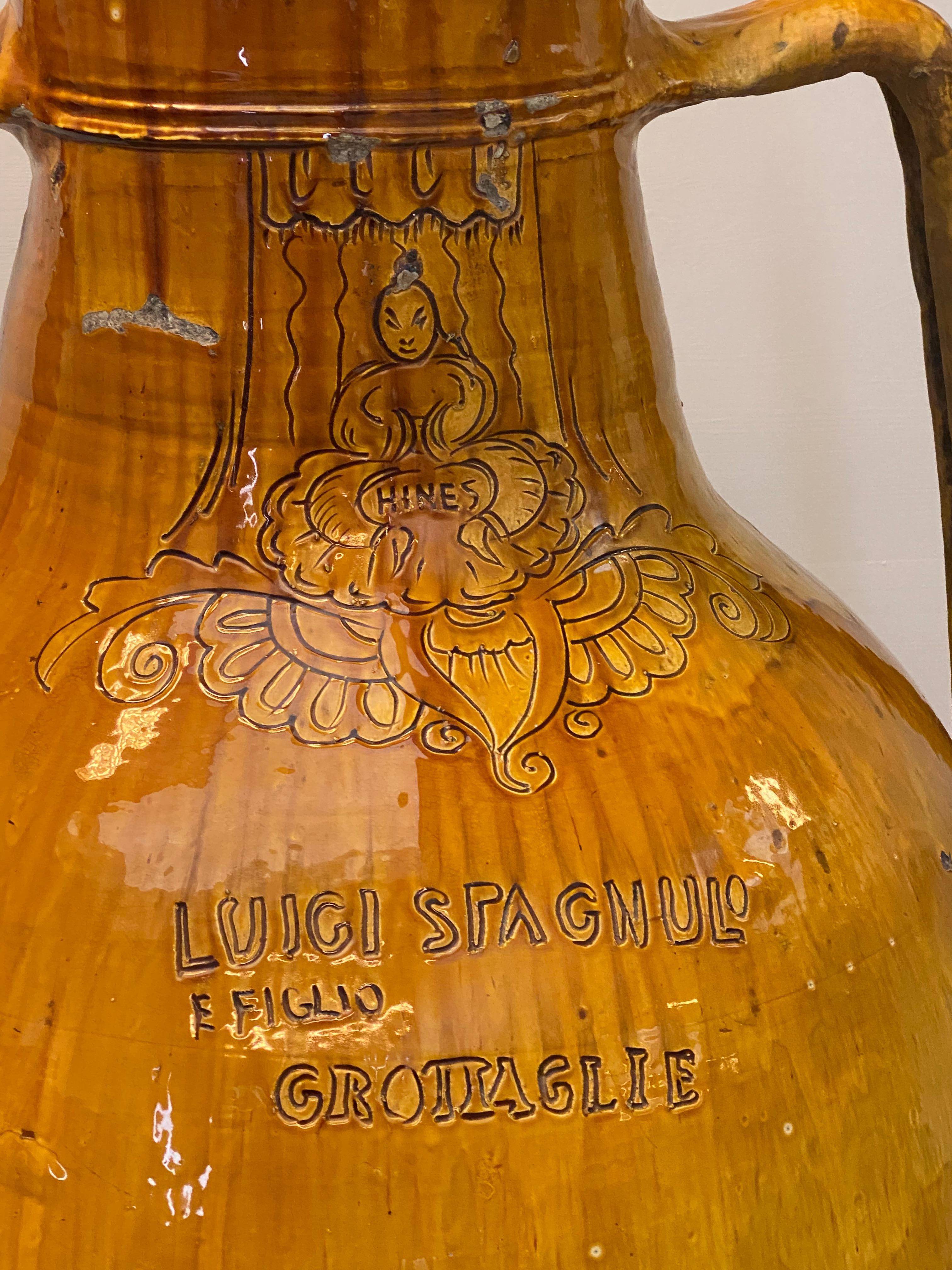 Beautiful Italian Terracotta Olive Oil Jar,
South Of Italy, Puglia Region,
nice brown-yellow color and great patina,
decorated and inscriptions,
Luigi Spagnulo & Figlio.