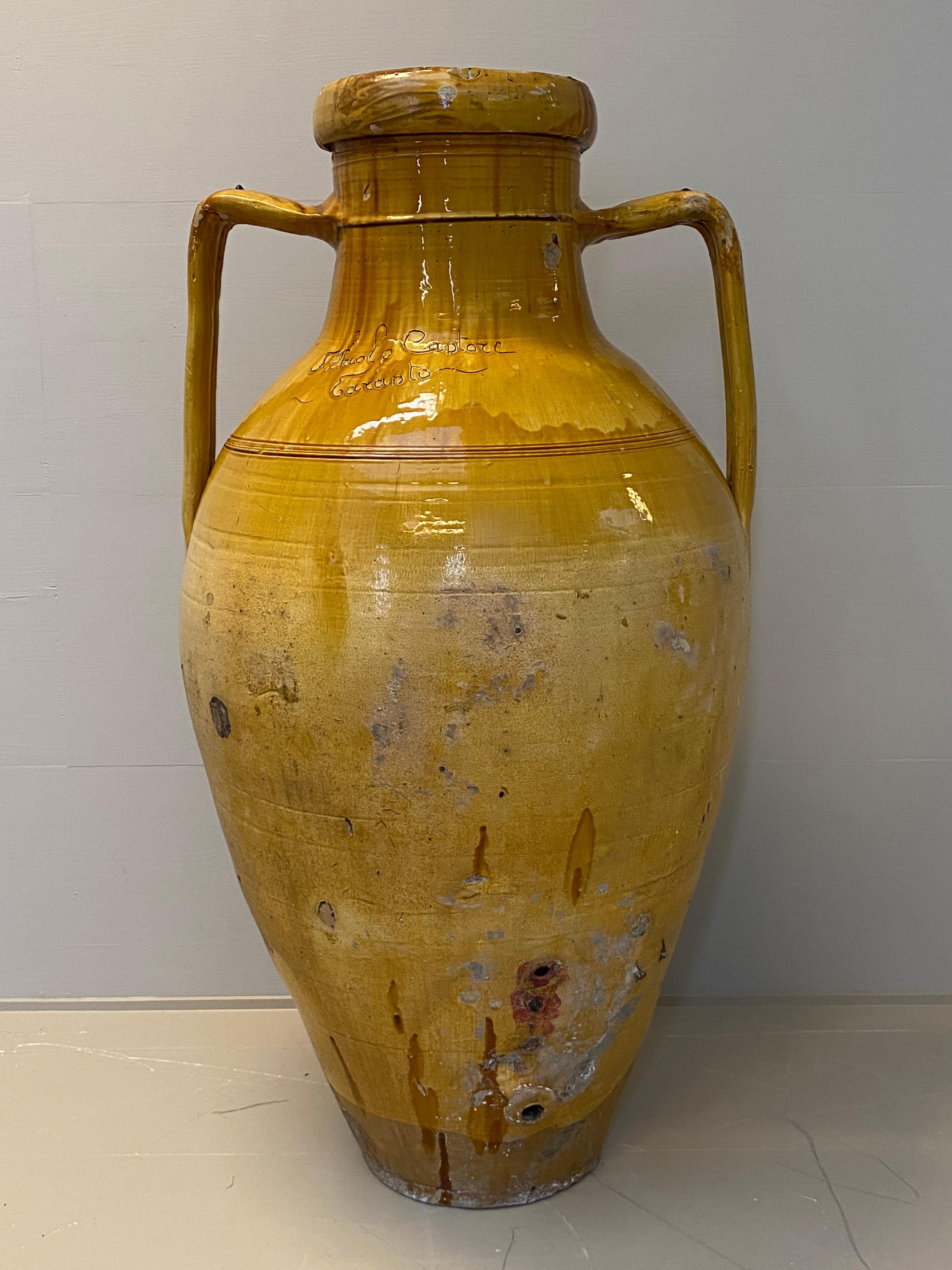 Beautiful Italian Terracotta Olive Oil Jar,
South of Italy ,Puglia Region,
Nice brown-yellow color and great patina,
Decorated and inscriptions,
Paolo Captore Taranto,
warm and worn finish the Jar