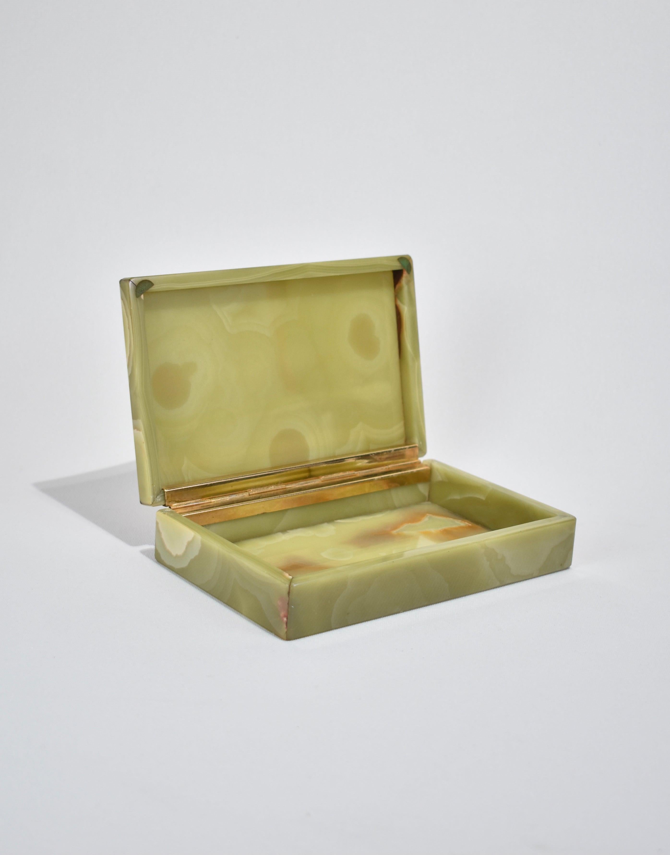 Stunning, polished green onyx box with hinged lid. Perfect size for jewelry or other small treasures. Made in Italy, ca. 1940s.