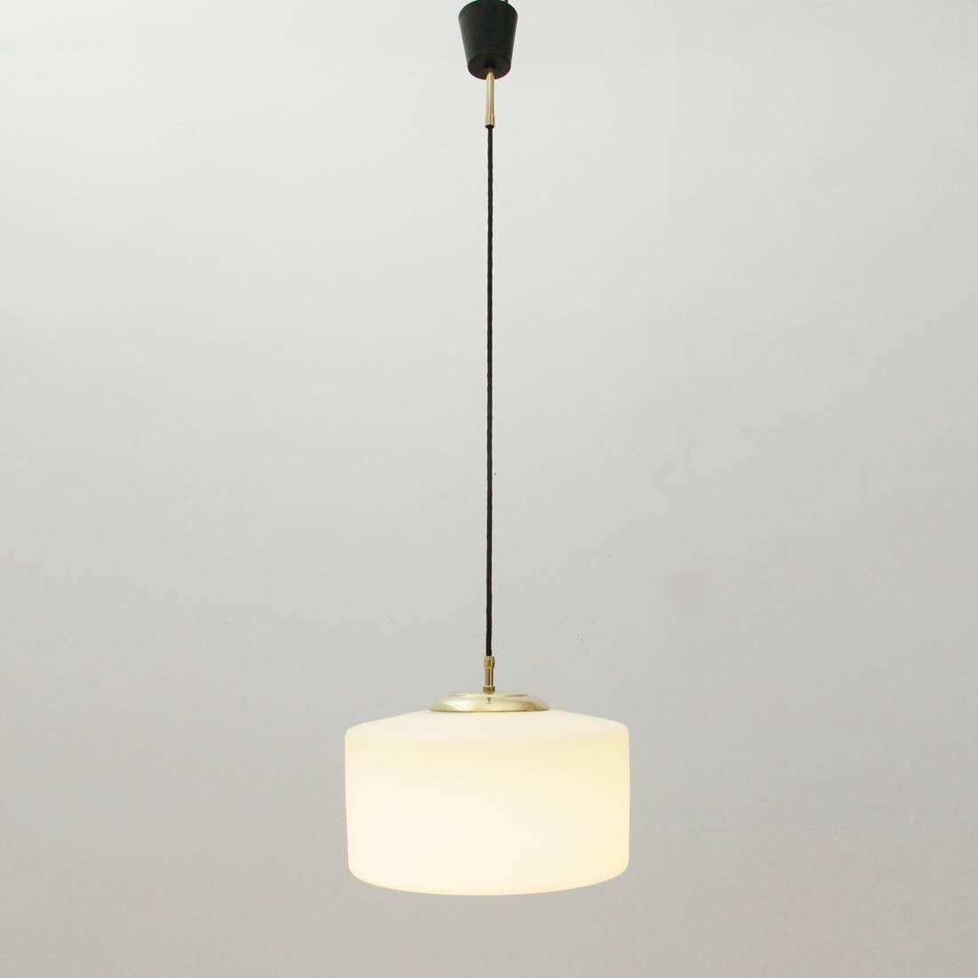 Italian manufacture chandelier from the 1950s.
Rosette in black painted aluminium and brass.
Diffuser in white opal glass and brass.
Good general conditions, some signs due to normal use over time.

Dimensions: Height 160 cm, diameter 32