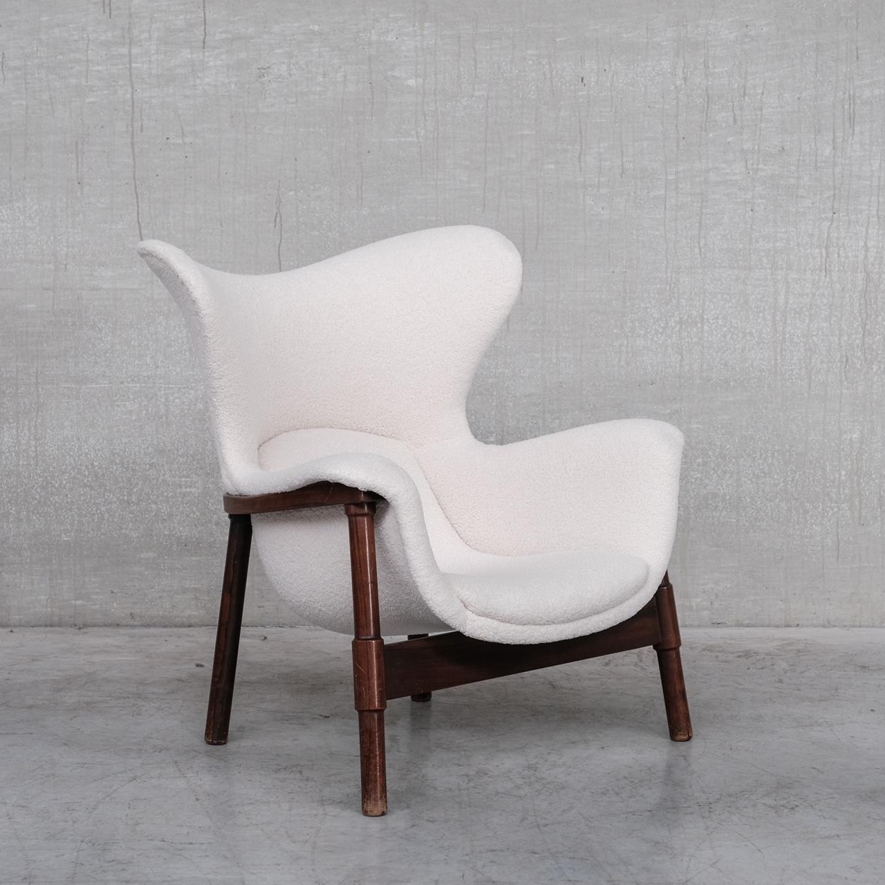 A generous mid-20th century armchair. 

Italy, c1960s. 

Re-upholstered in a white boucle style fabric, a pleasing contrast to the wooden frame. 

Anonymous designer, but one of the best armchairs we have managed to source. 

Location: